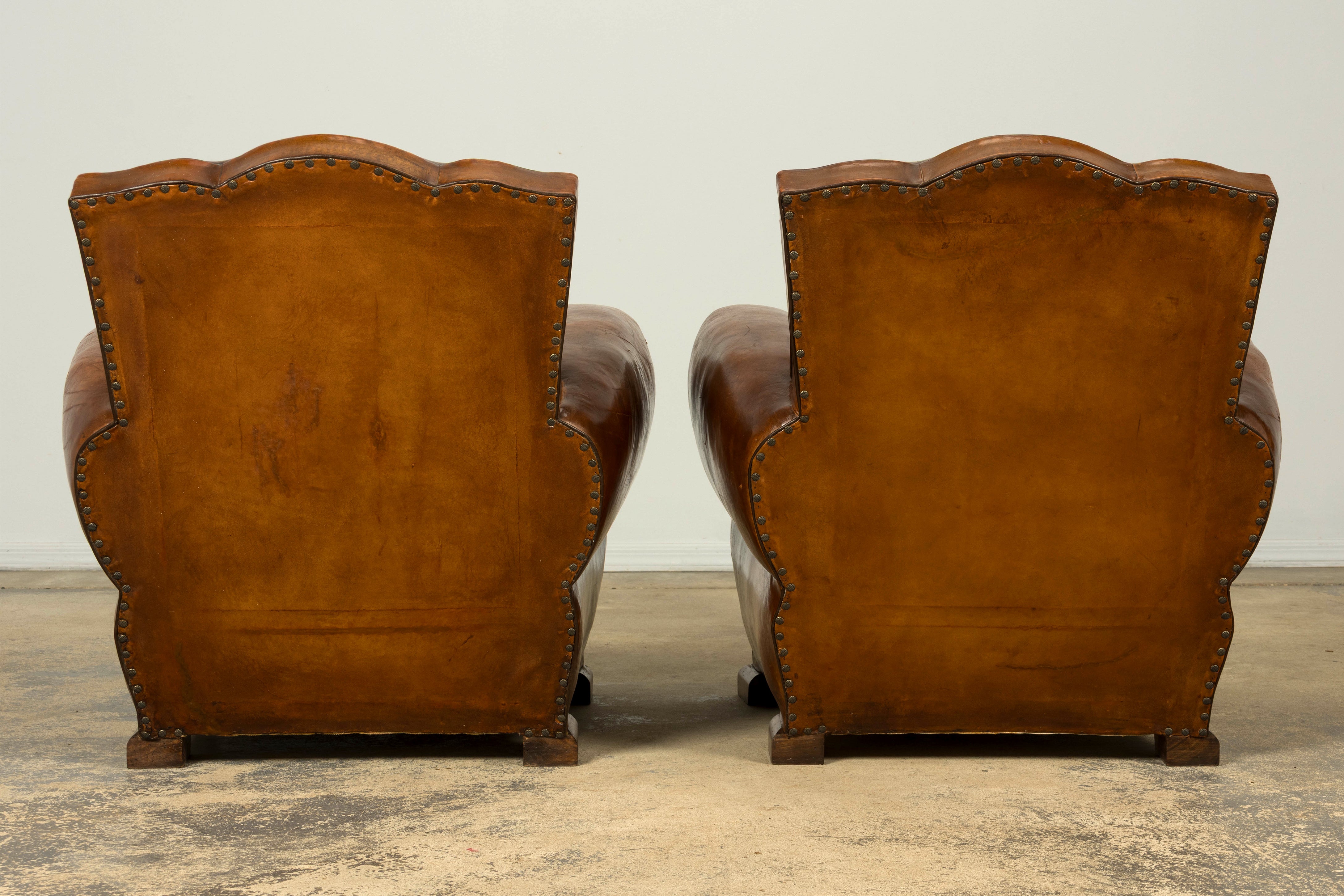 1920s French Art Deco Scalloped Back Cognac Leather Club Chairs – A Pair