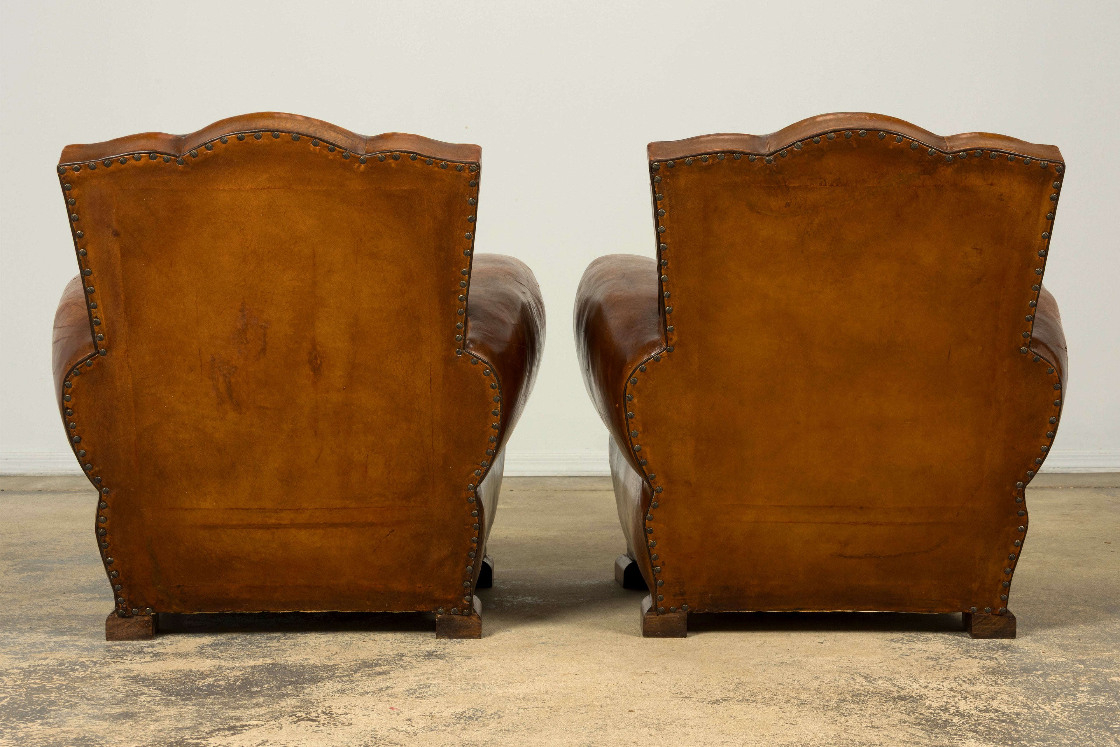 1920s French Art Deco Scalloped Back Cognac Leather Club Chairs – A Pair
