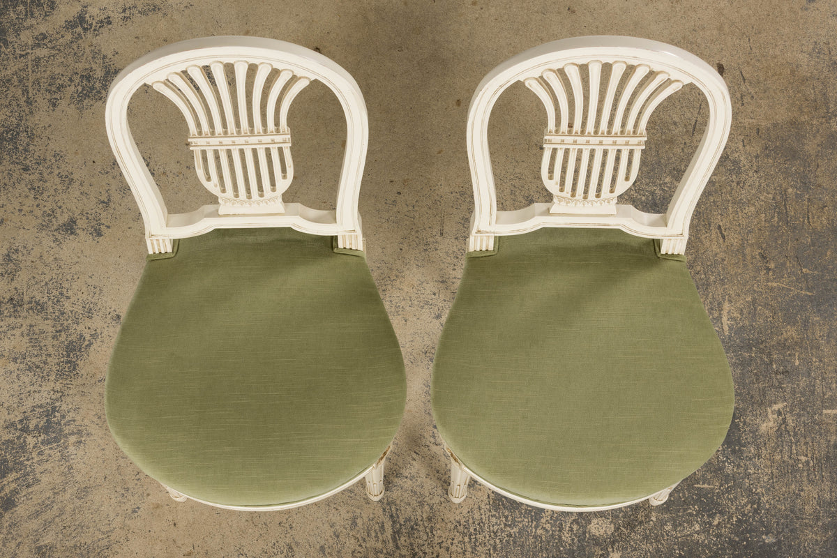 Pair of French Louis XVI Neoclassical Style Painted Lyre Back Accent Chairs in Laurel Green Velvet