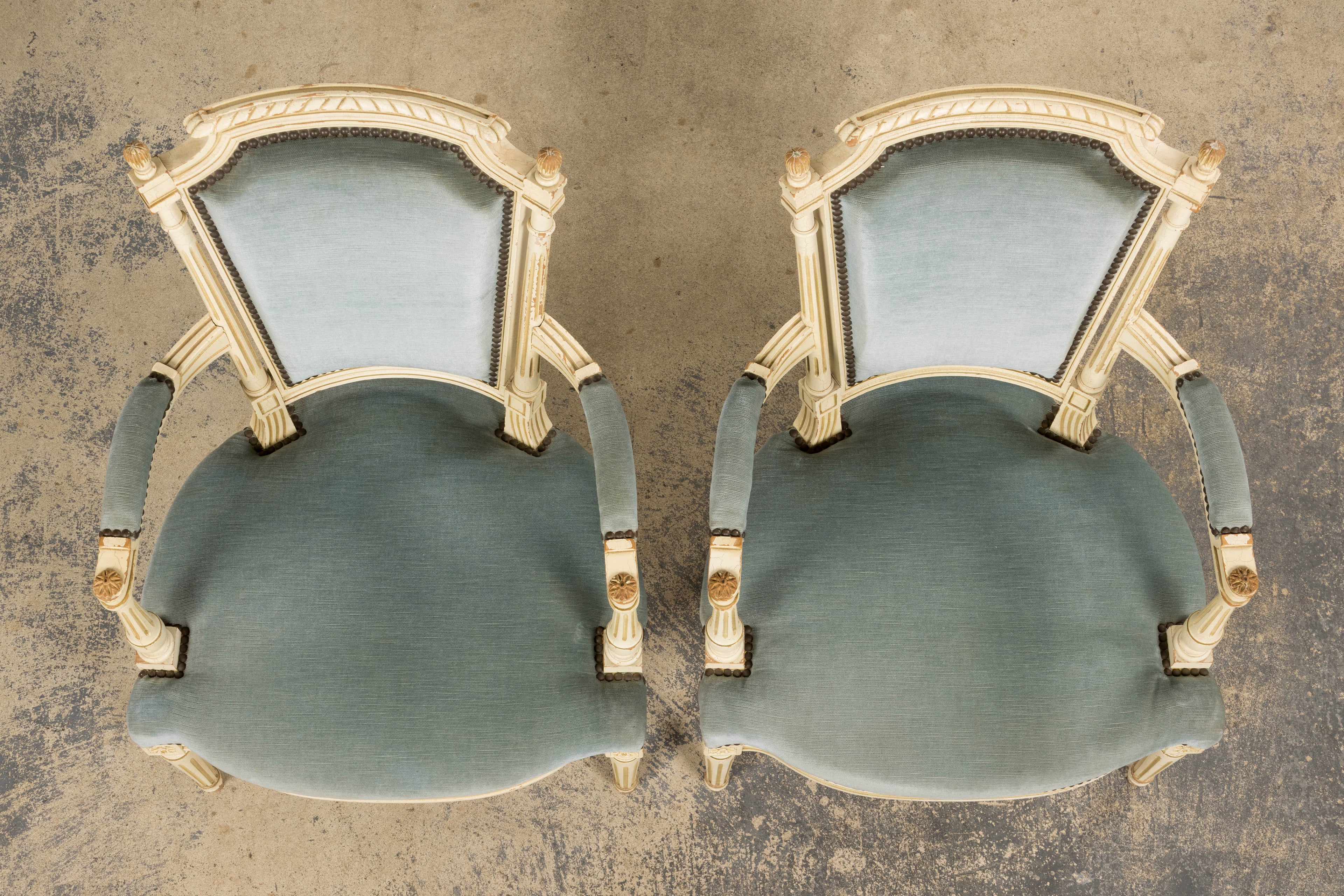 A Pair of Antique French Louis XVI Style Painted Armchairs In Blue Velvet