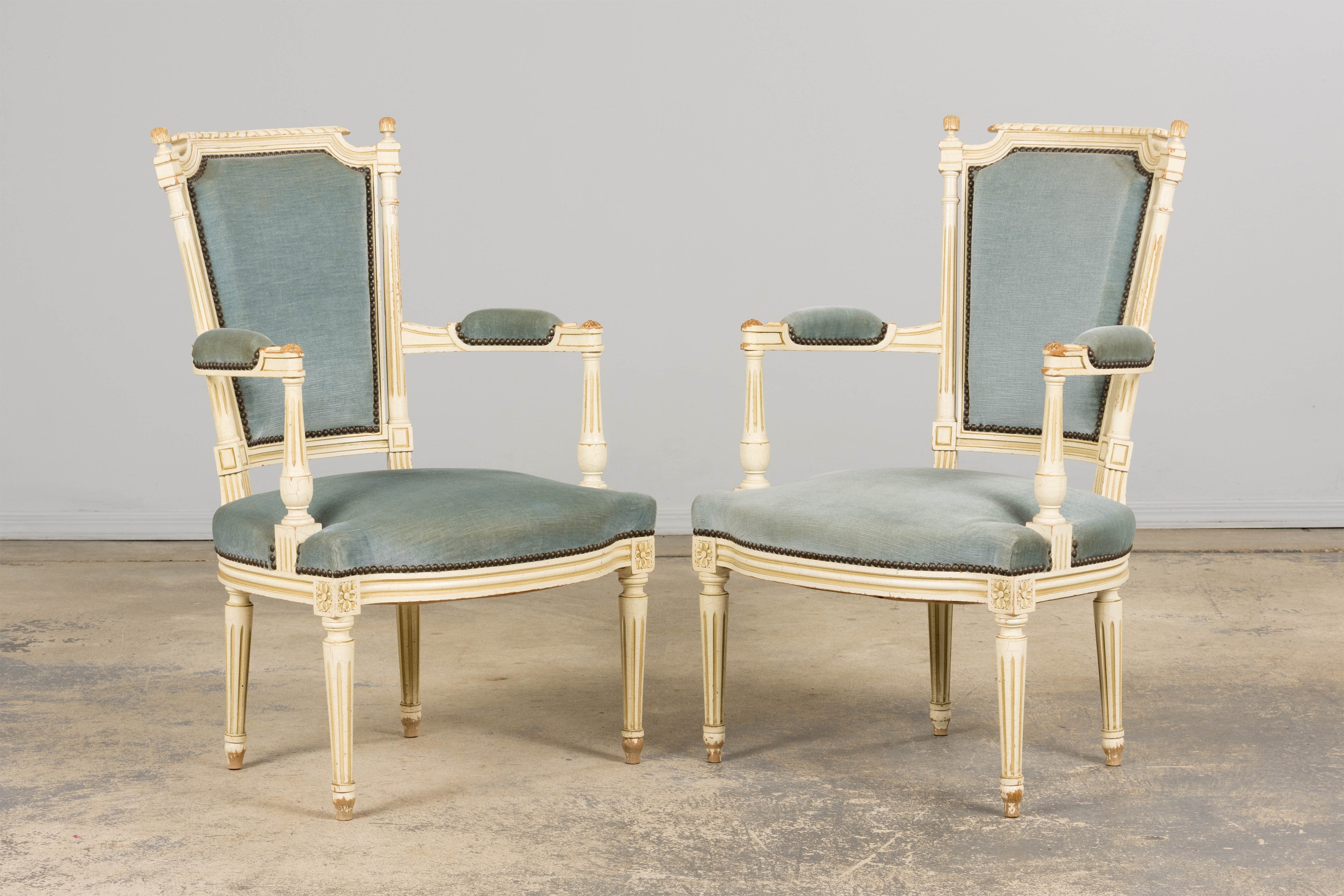 A Pair of Antique French Louis XVI Style Painted Armchairs In Blue Velvet