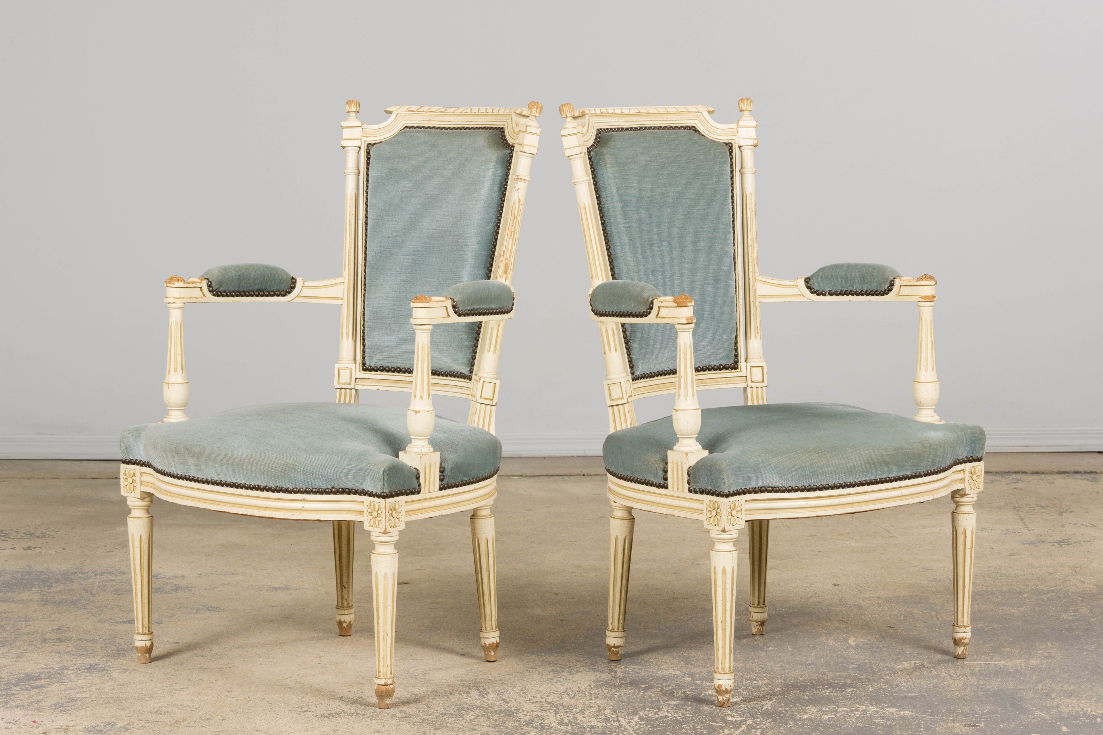A Pair of Antique French Louis XVI Style Painted Armchairs In Blue Velvet
