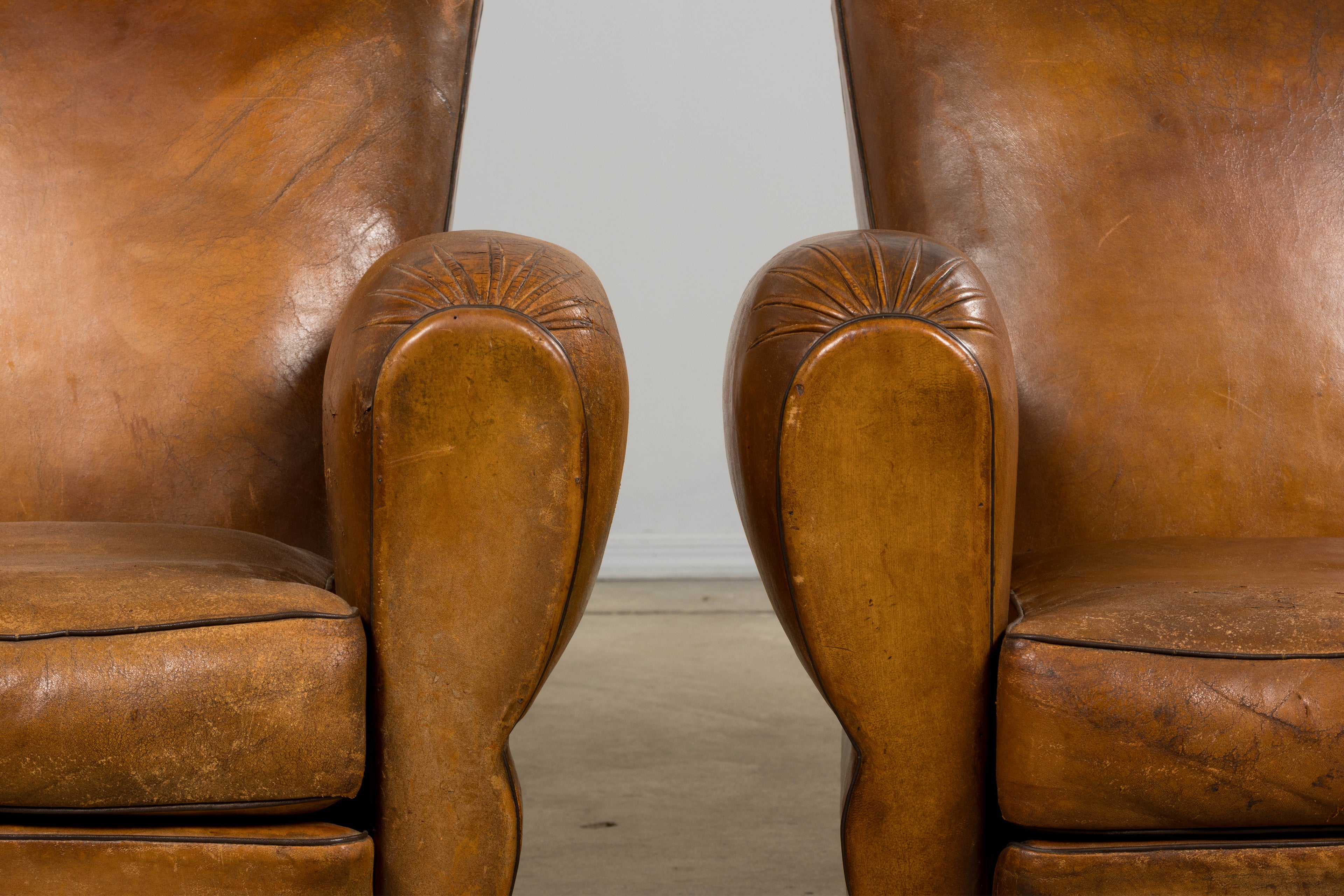 ON HOLD 1920s French Art Deco Scalloped Back Club Chairs in Caramel Leather – A Pair