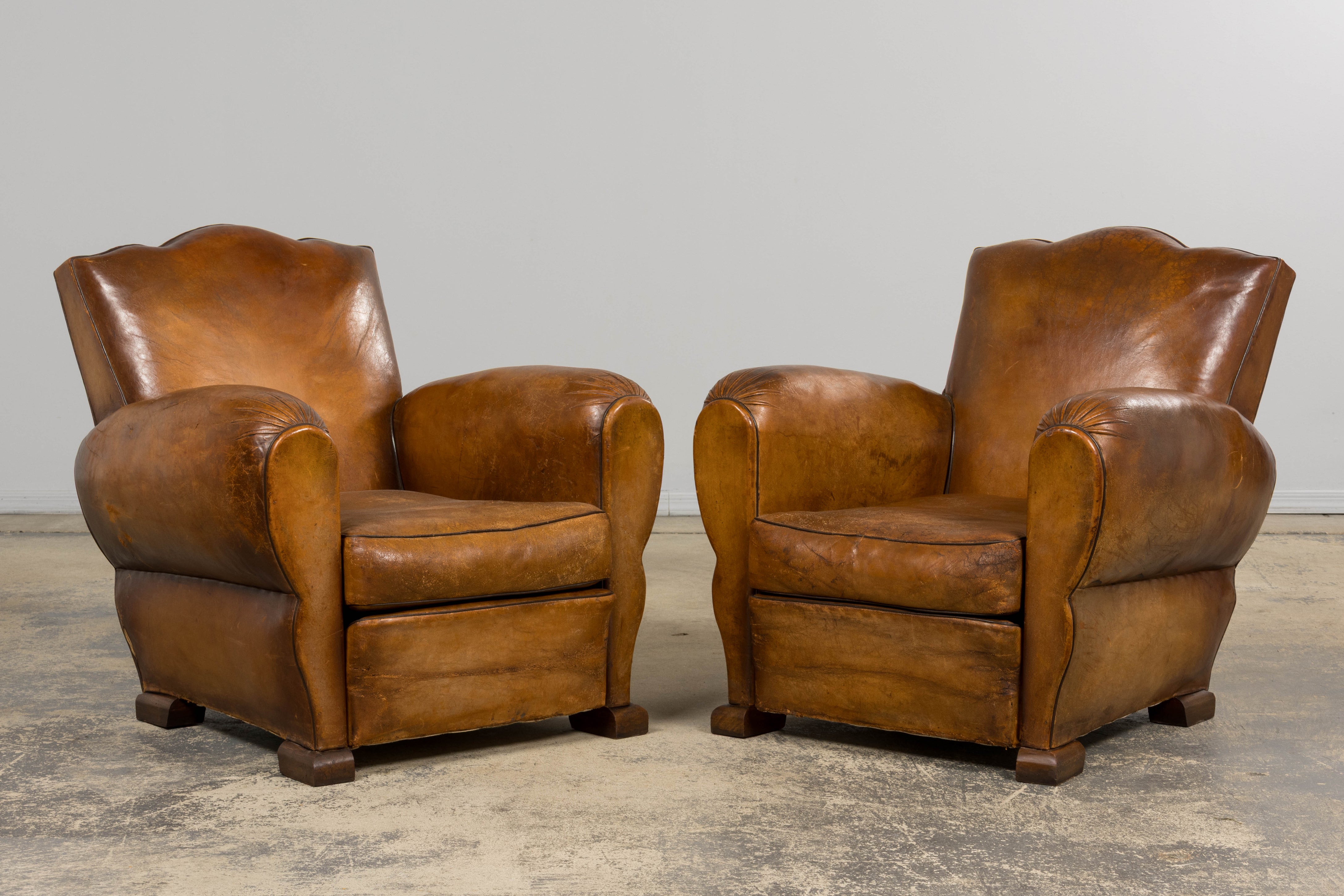 1920s French Art Deco Scalloped Back Club Chairs in Caramel Leather – A Pair