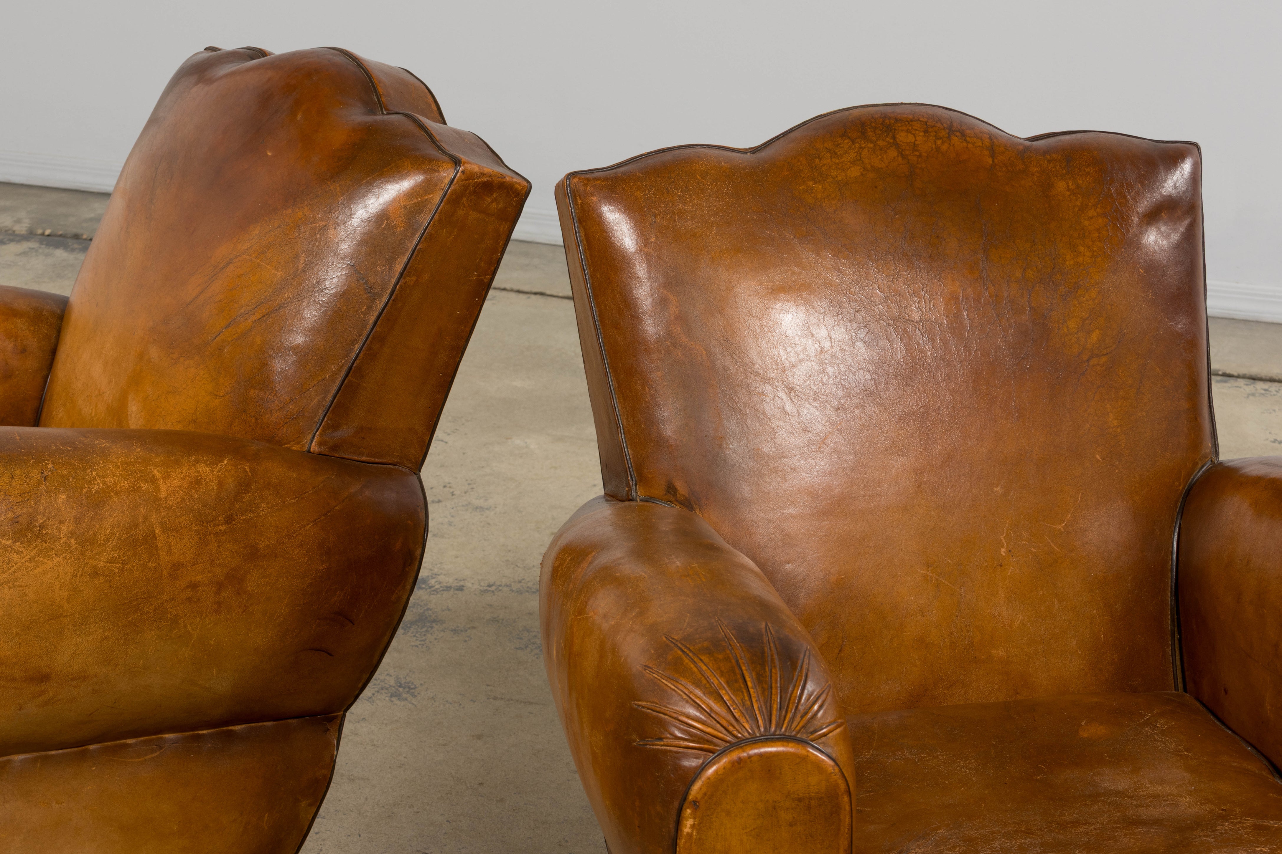 1920s French Art Deco Scalloped Back Club Chairs in Caramel Leather – A Pair