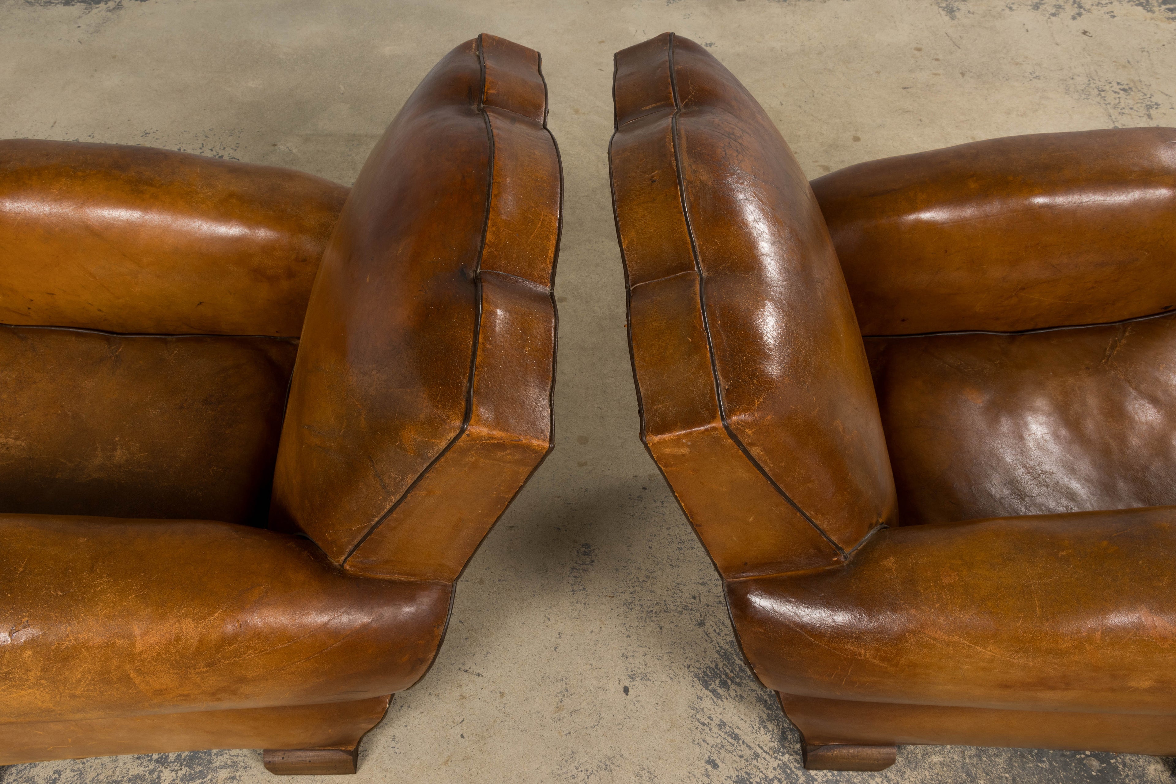 ON HOLD 1920s French Art Deco Scalloped Back Club Chairs in Caramel Leather – A Pair