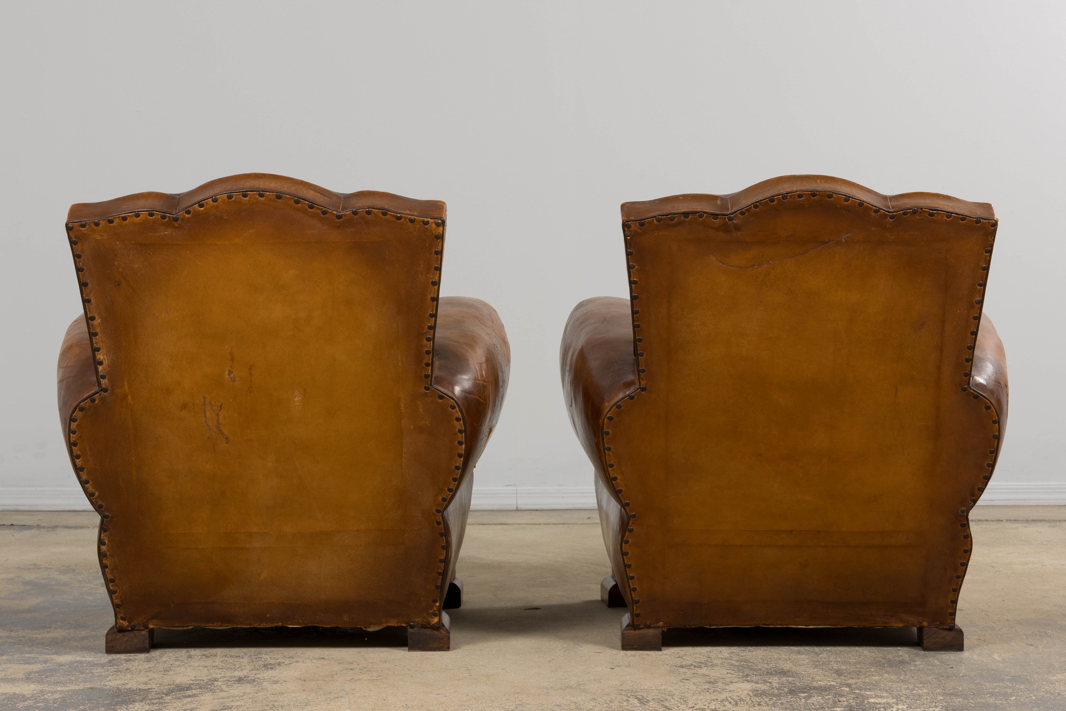 1920s French Art Deco Scalloped Back Club Chairs in Caramel Leather – A Pair