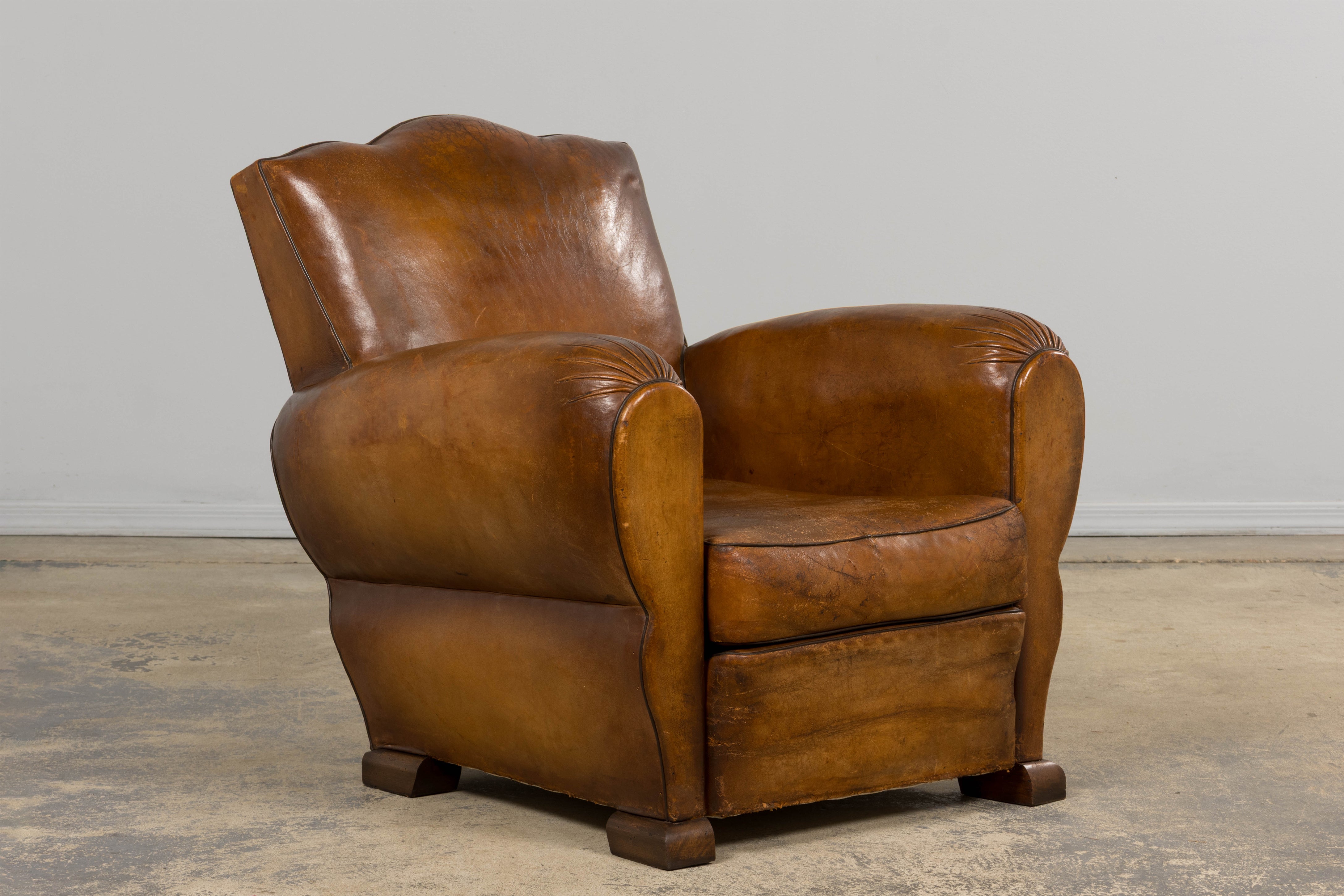 1920s French Art Deco Scalloped Back Club Chairs in Caramel Leather – A Pair