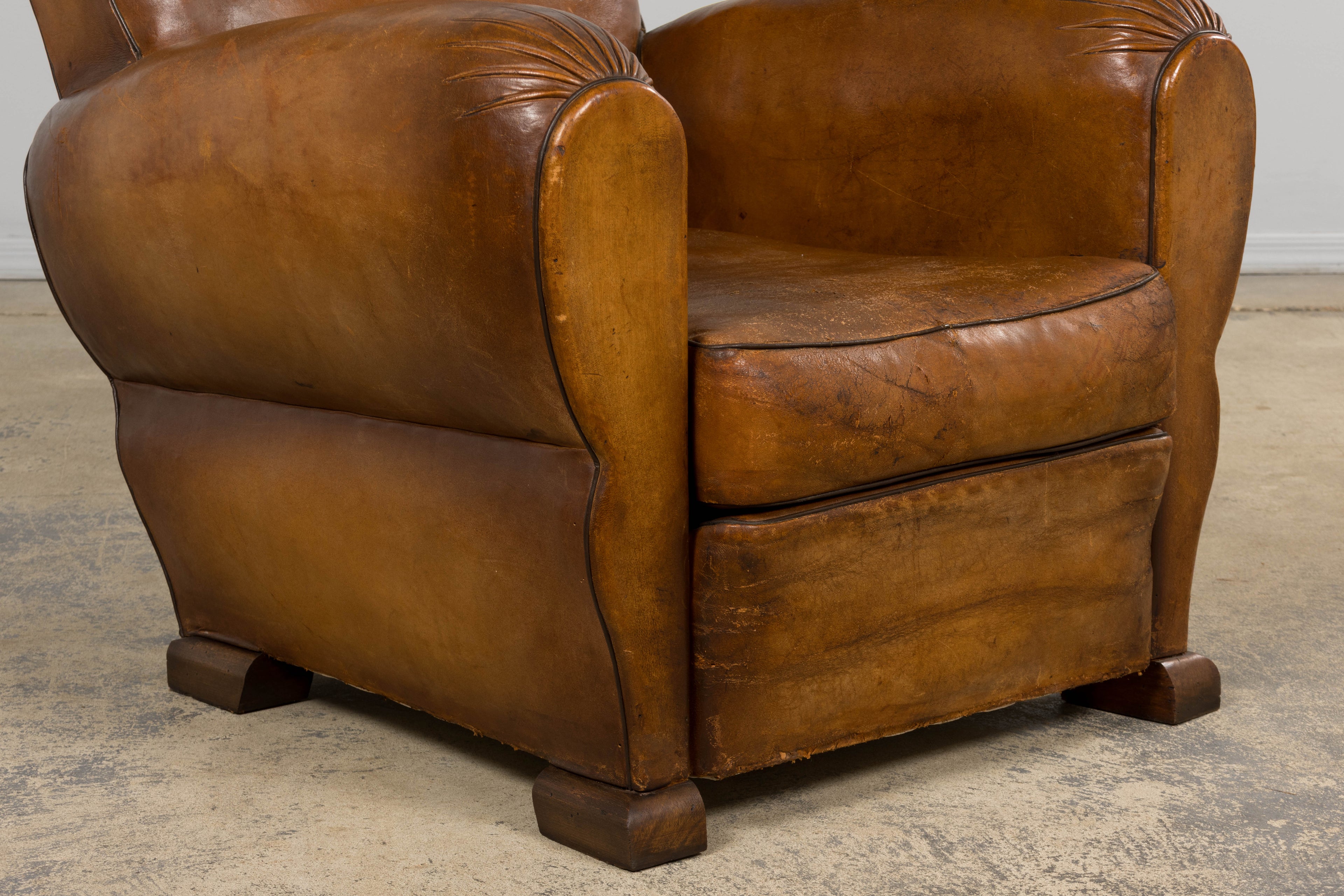 ON HOLD 1920s French Art Deco Scalloped Back Club Chairs in Caramel Leather – A Pair