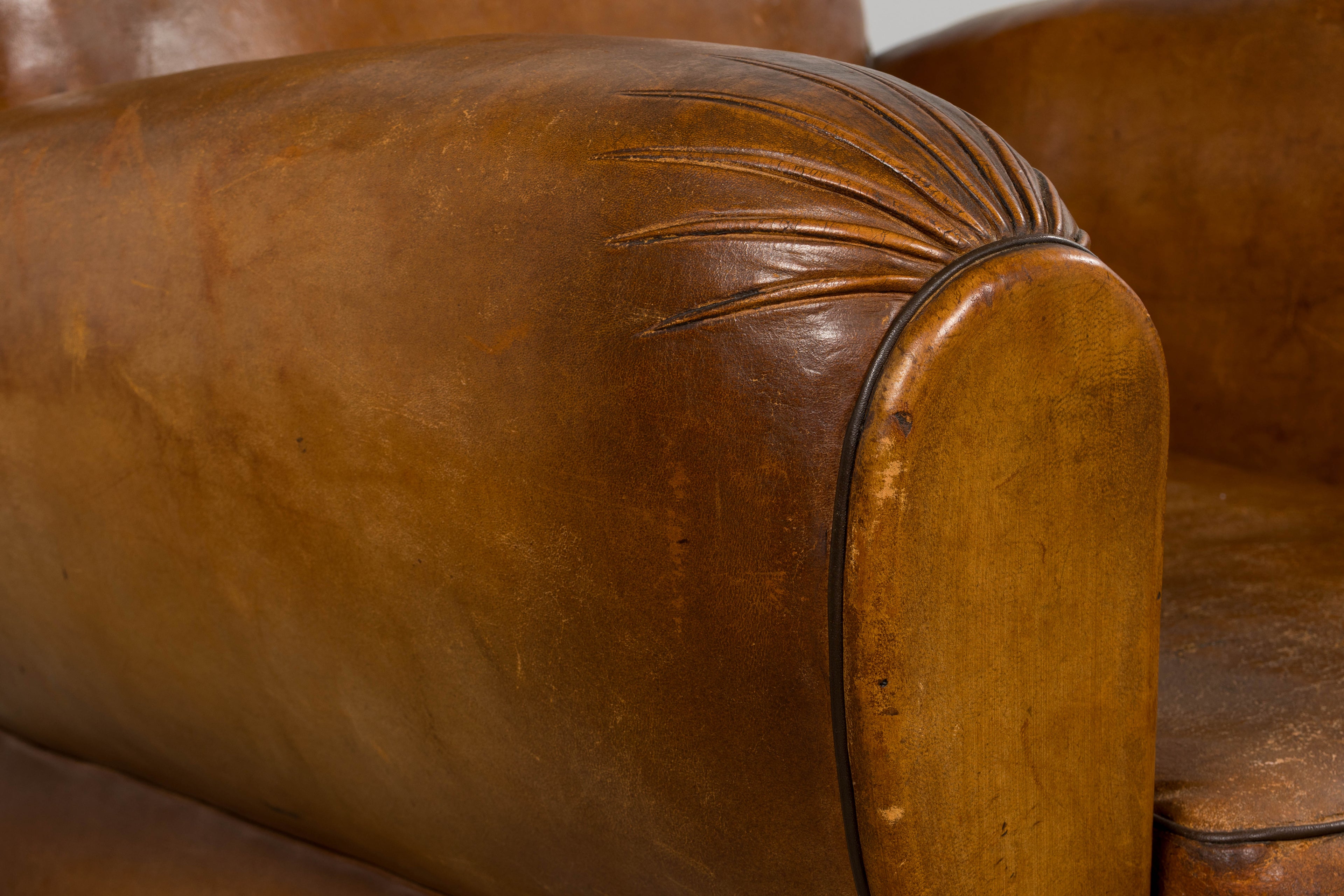 ON HOLD 1920s French Art Deco Scalloped Back Club Chairs in Caramel Leather – A Pair