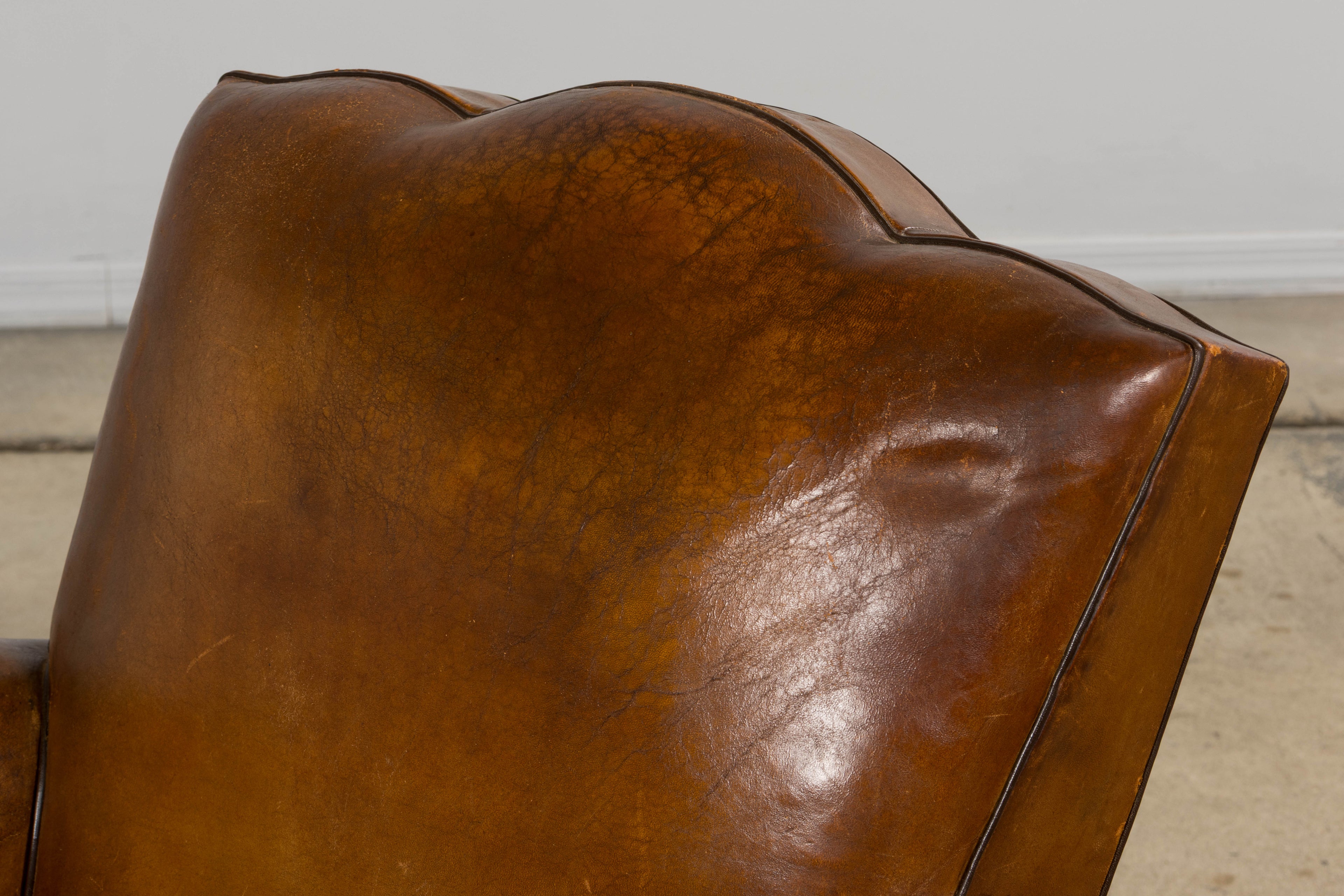 ON HOLD 1920s French Art Deco Scalloped Back Club Chairs in Caramel Leather – A Pair