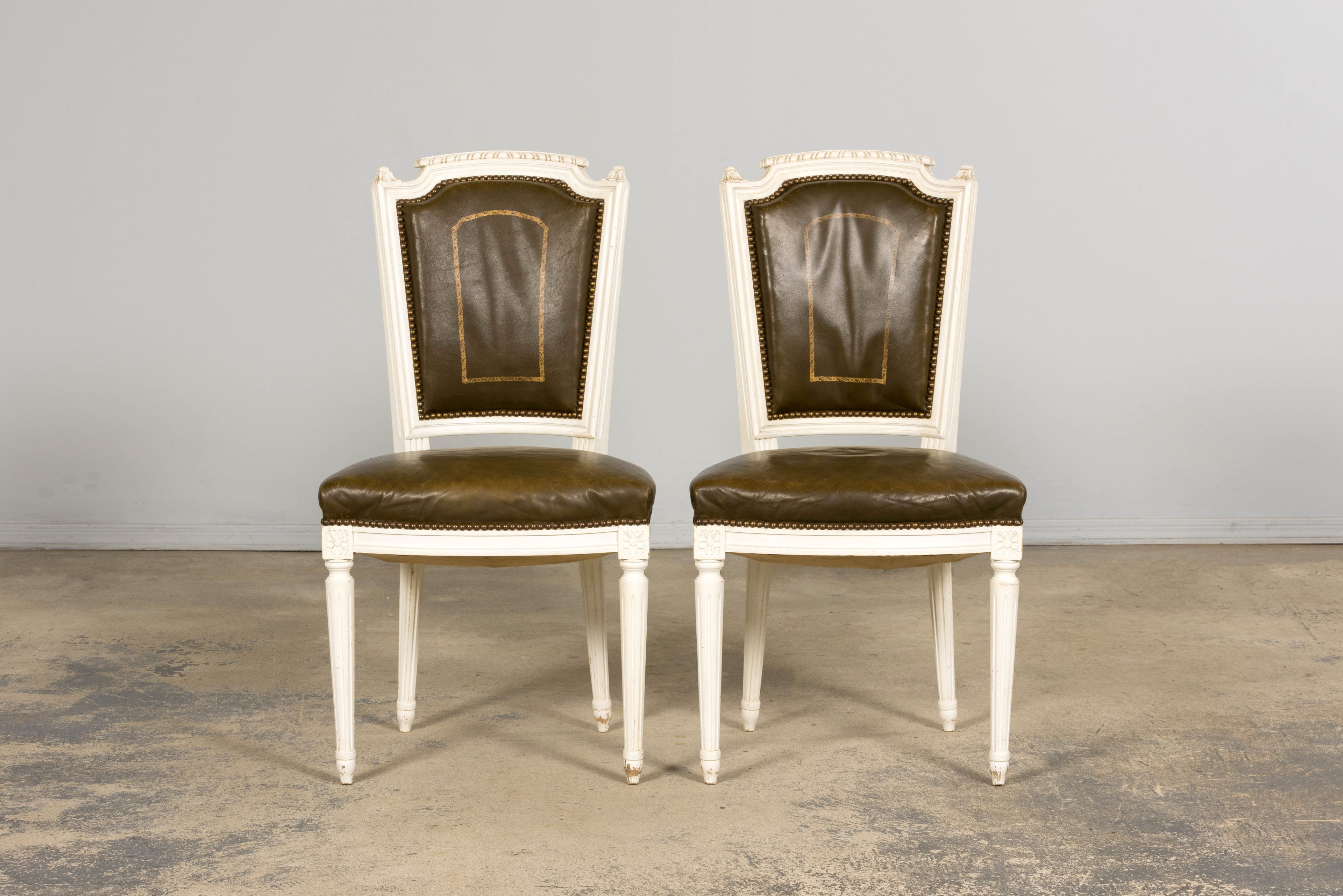 Antique French Louis XVI Style Painted Chairs with Olive Green Leather - A Pair