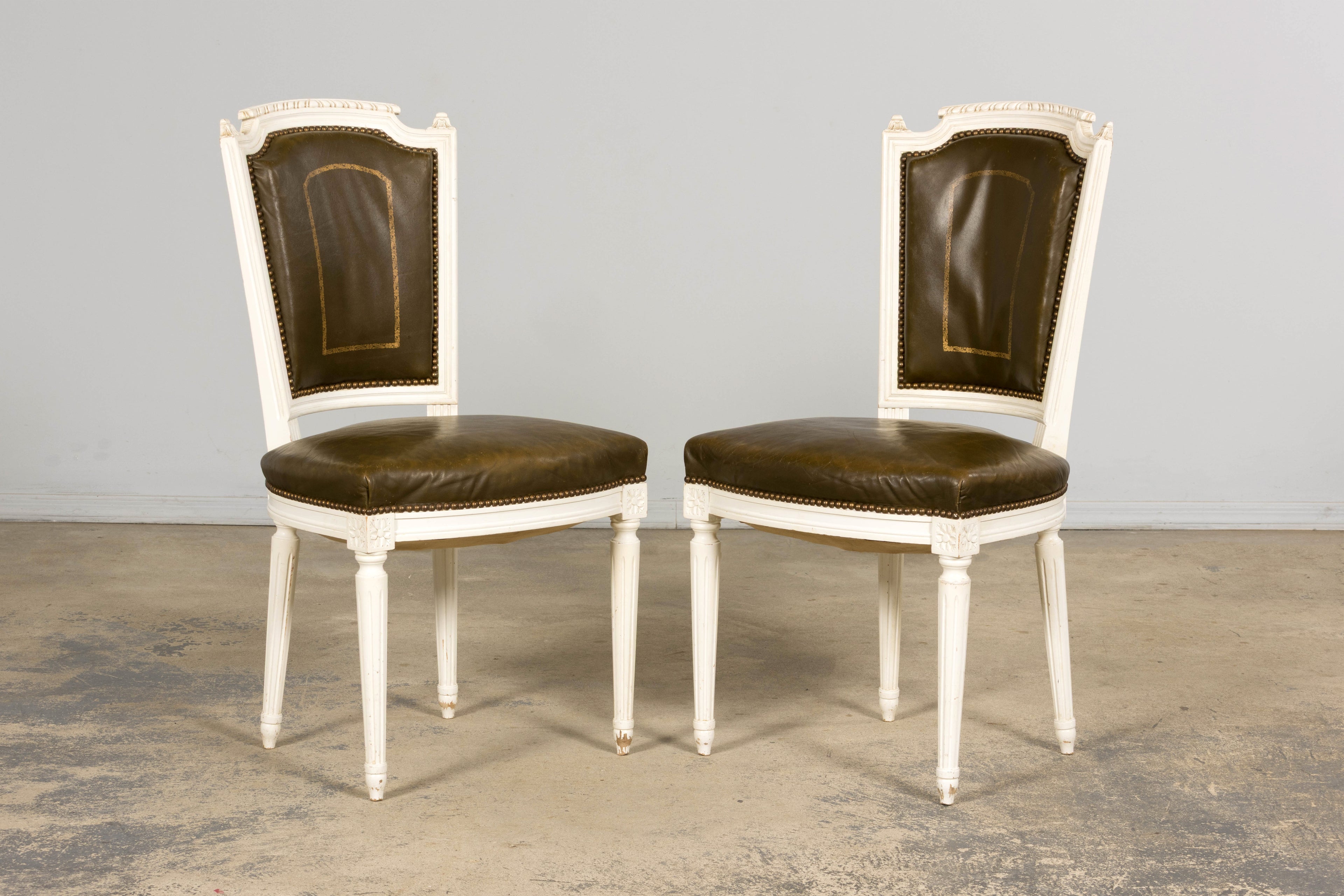 Antique French Louis XVI Style Painted Chairs with Olive Green Leather - A Pair
