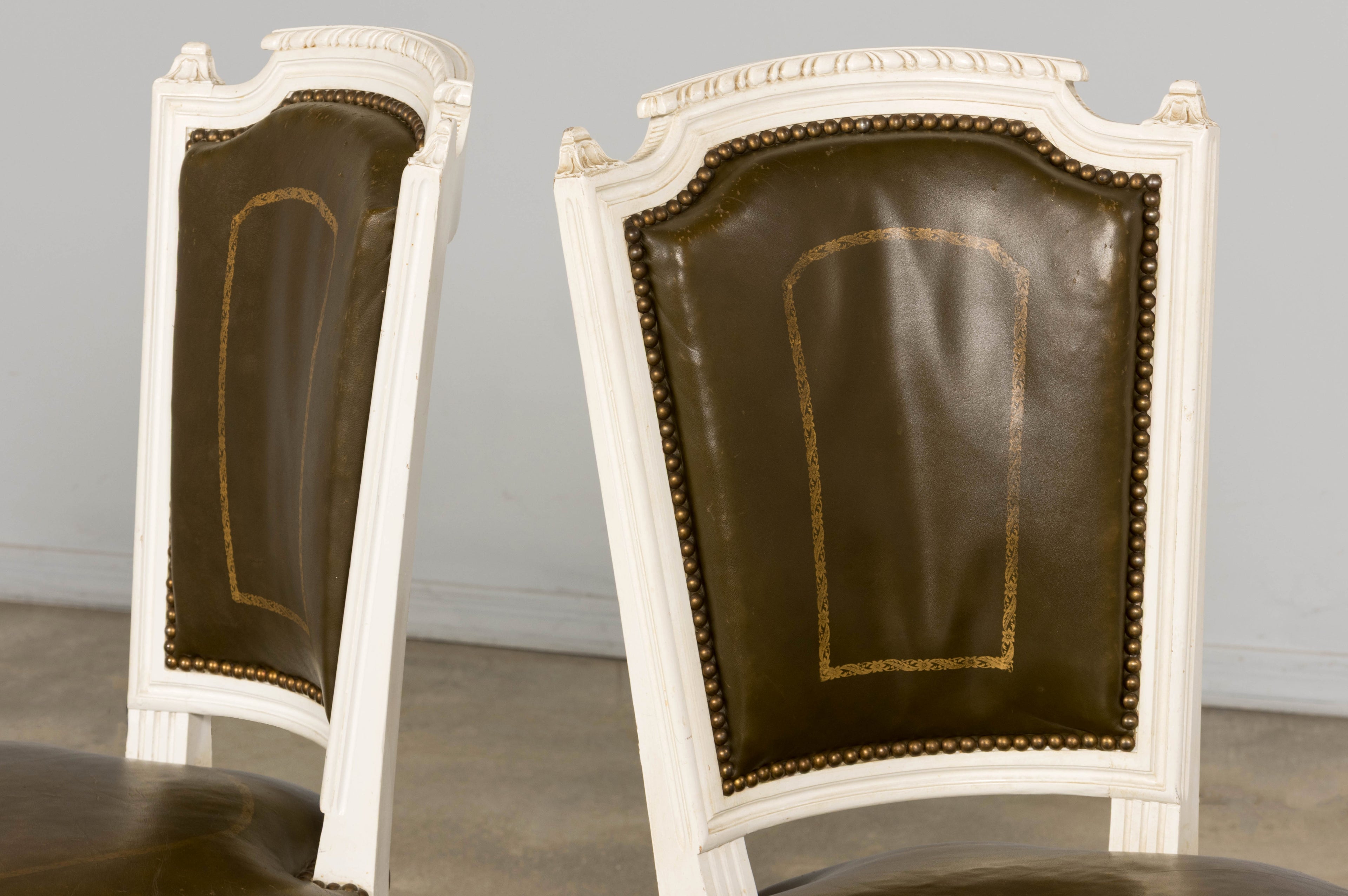 Antique French Louis XVI Style Painted Chairs with Olive Green Leather - A Pair