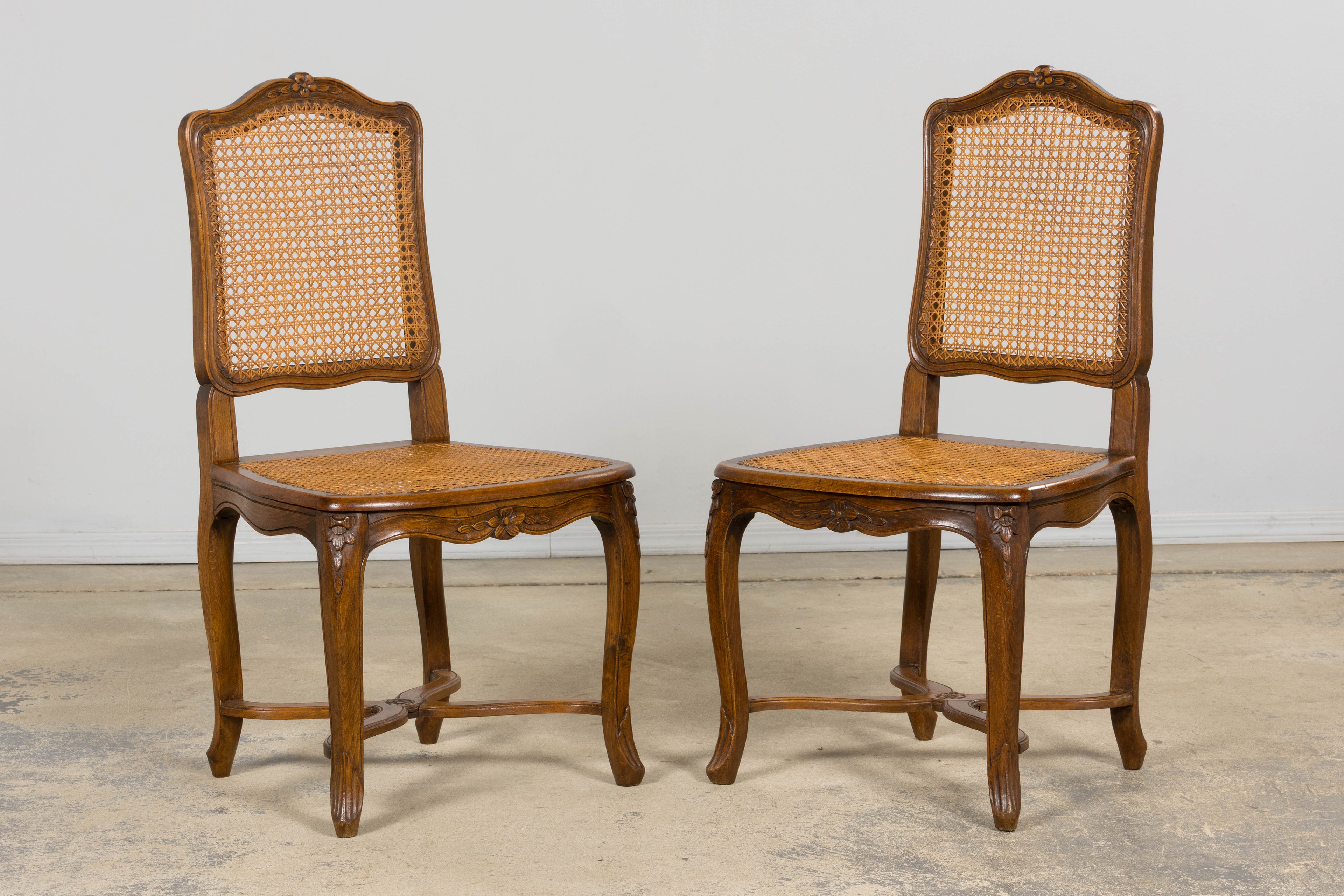 Antique French Louis XV Style Provincial Walnut Cane Dining Chairs, Set of 12
