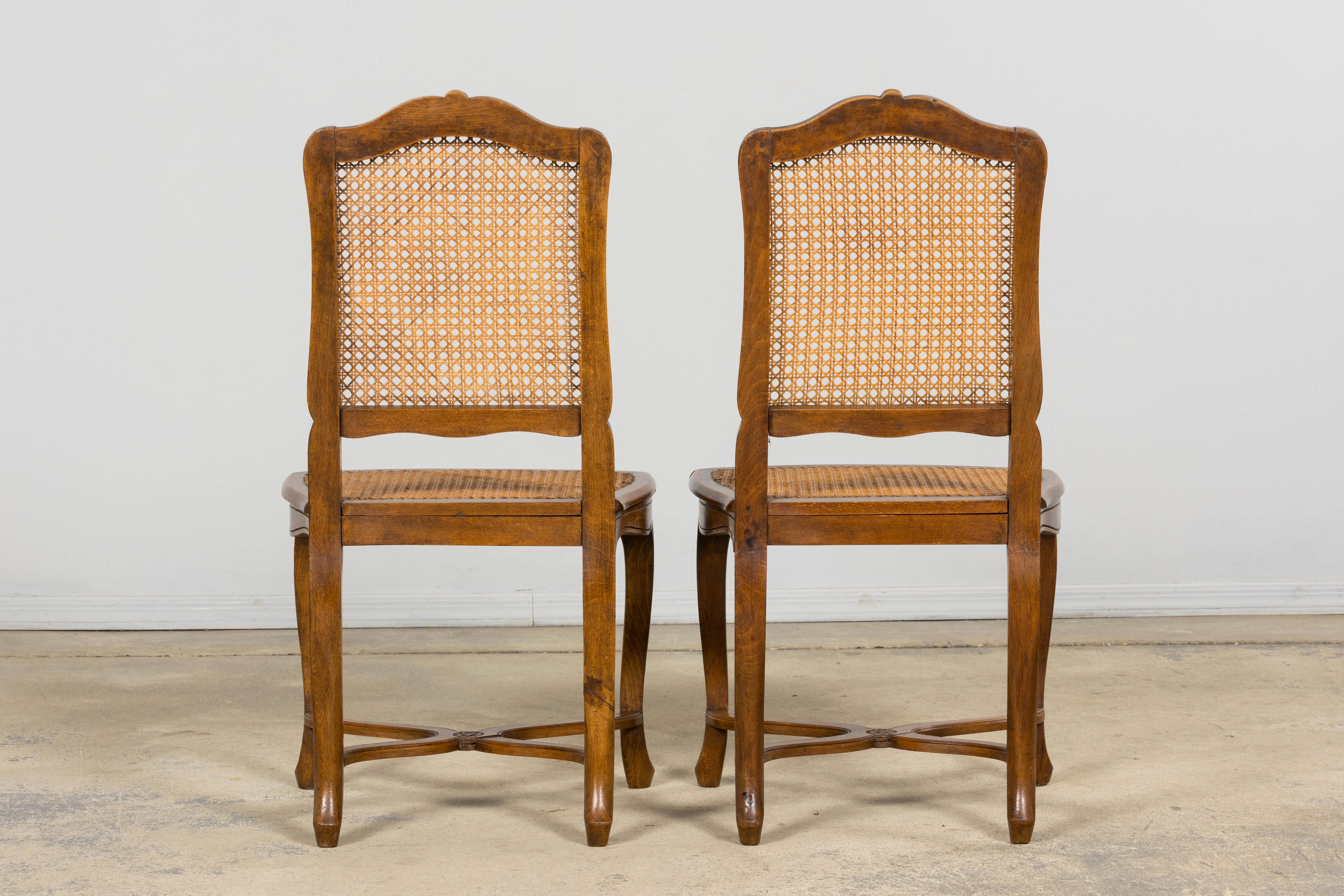 Antique French Louis XV Style Provincial Walnut Cane Dining Chairs, Set of 12