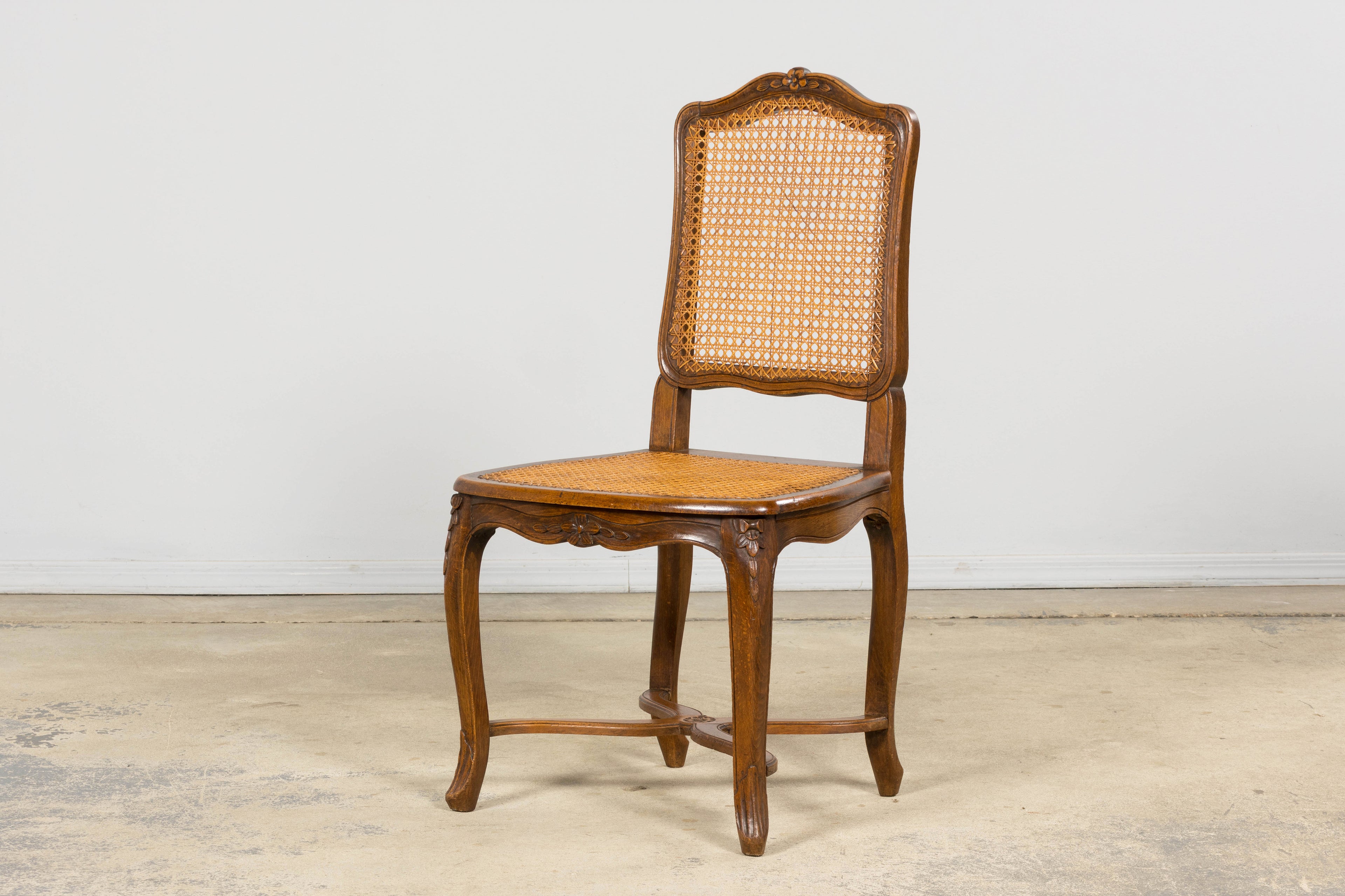 Antique French Louis XV Style Provincial Walnut Cane Dining Chairs, Set of 12