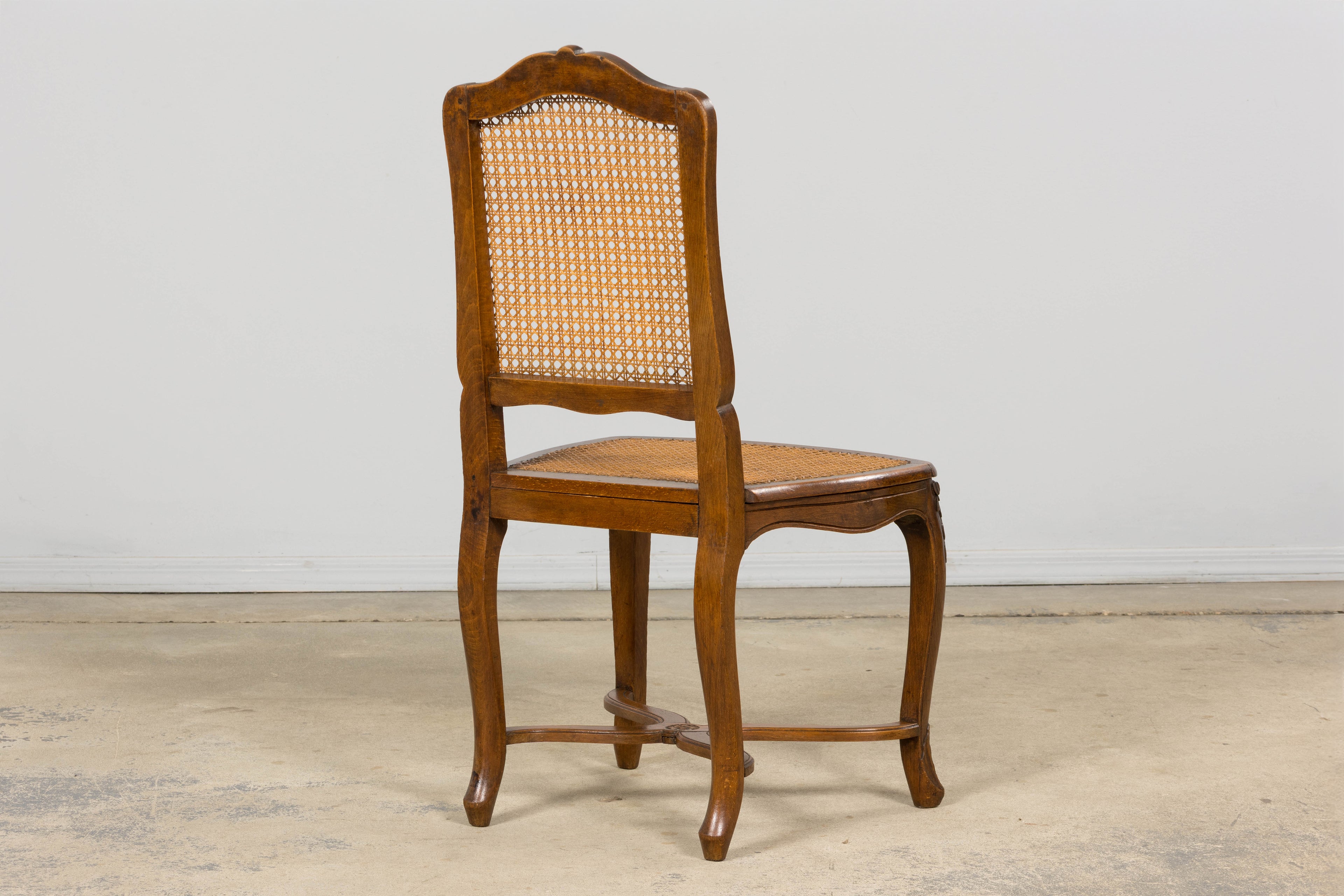 Antique French Louis XV Style Provincial Walnut Cane Dining Chairs, Set of 12