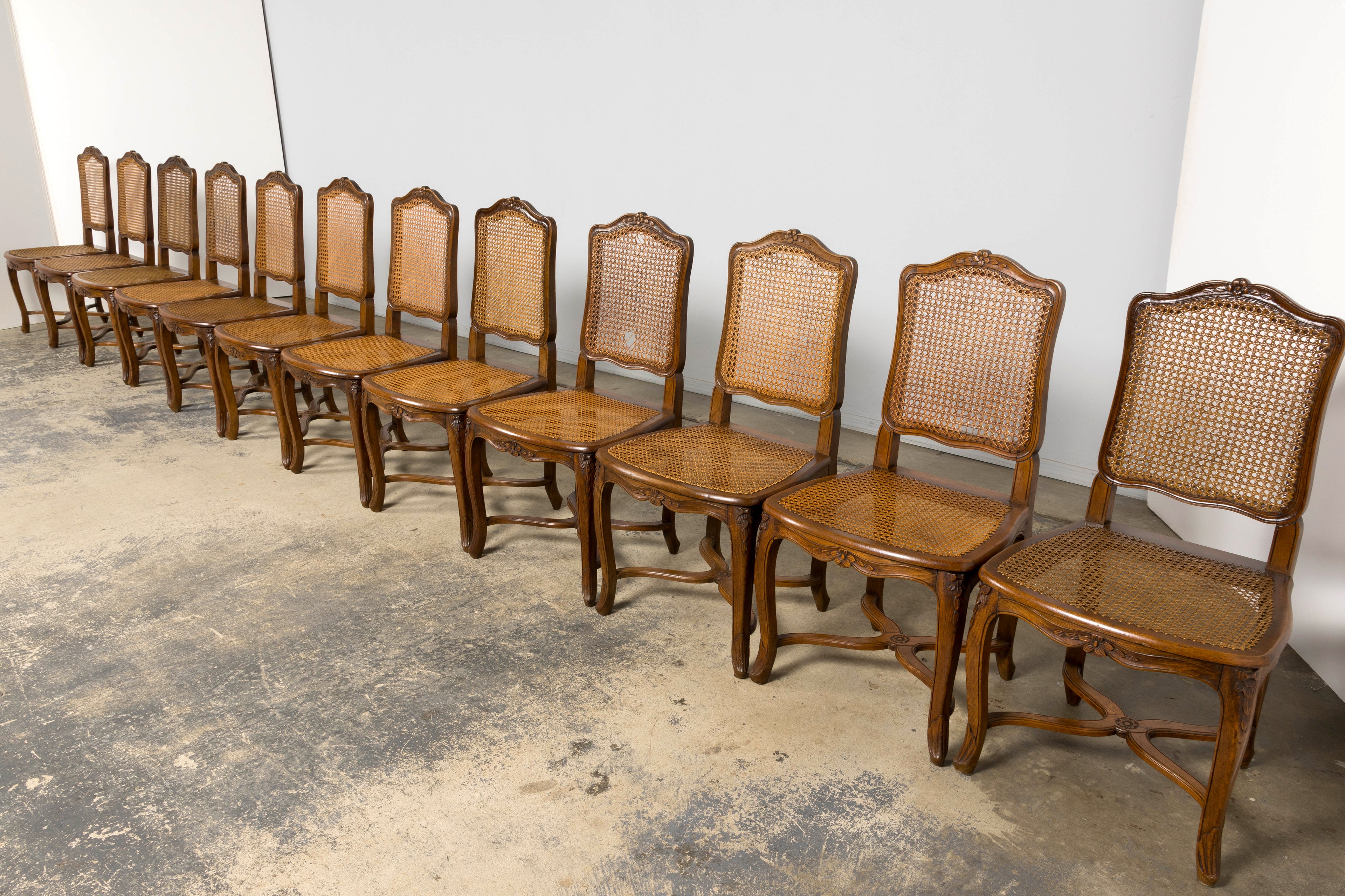 Antique French Louis XV Style Provincial Walnut Cane Dining Chairs, Set of 12