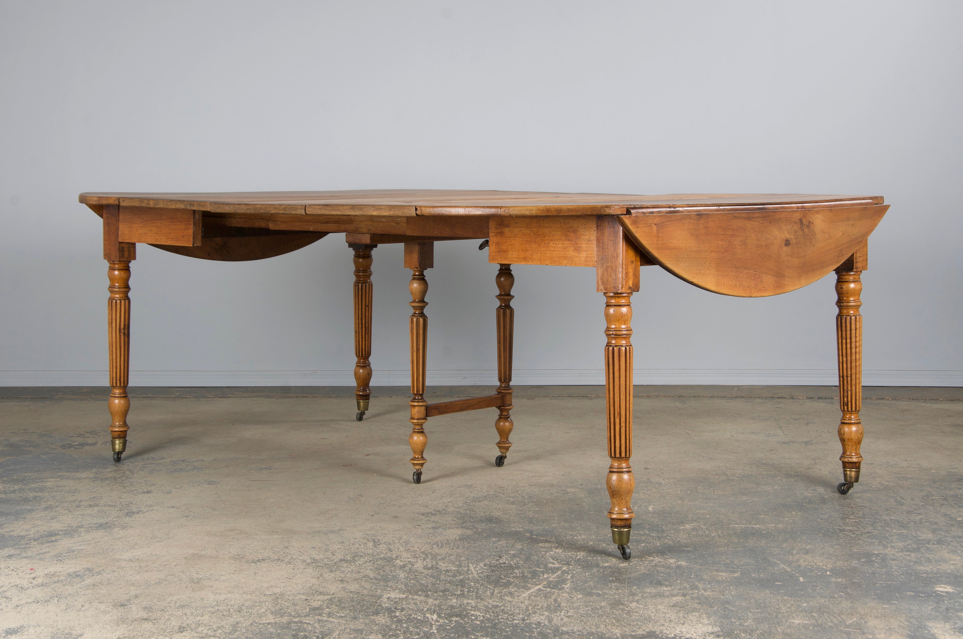 19th Century French Louis Philippe Style Walnut Extendable Drop Leaf Table