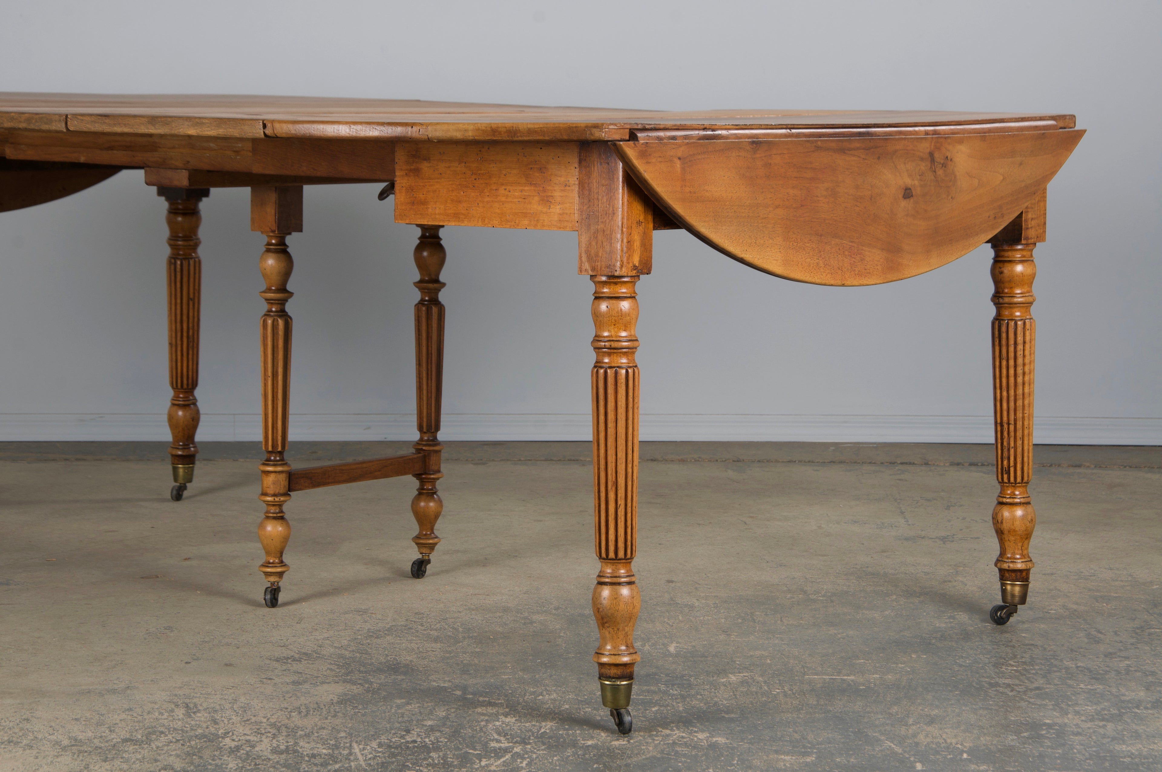 19th Century French Louis Philippe Style Walnut Extendable Drop Leaf Table