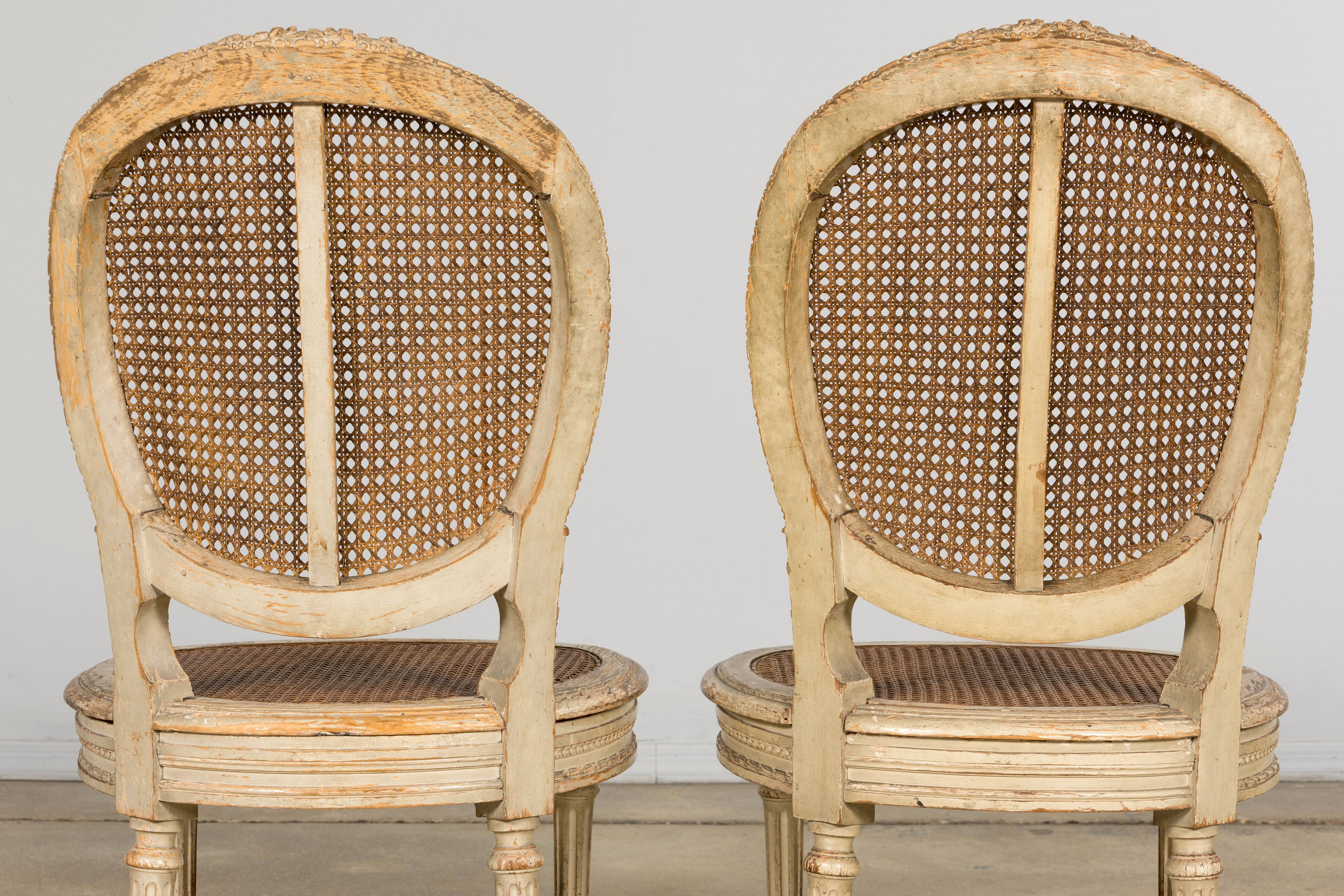 Early 19th Century French Louis XVI Painted Cane Dining Chairs - Set of 10