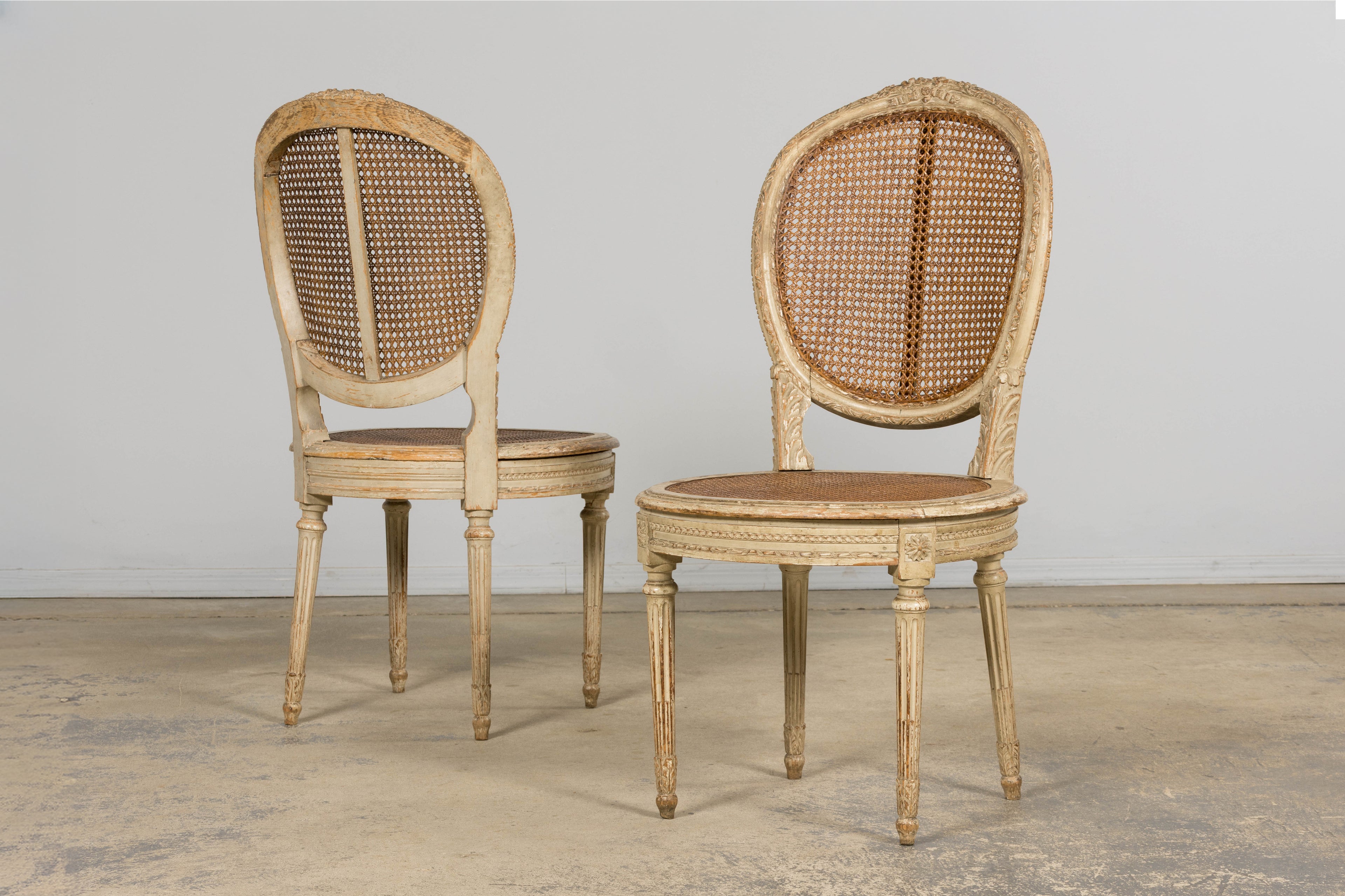 Early 19th Century French Louis XVI Painted Cane Dining Chairs - Set of 10