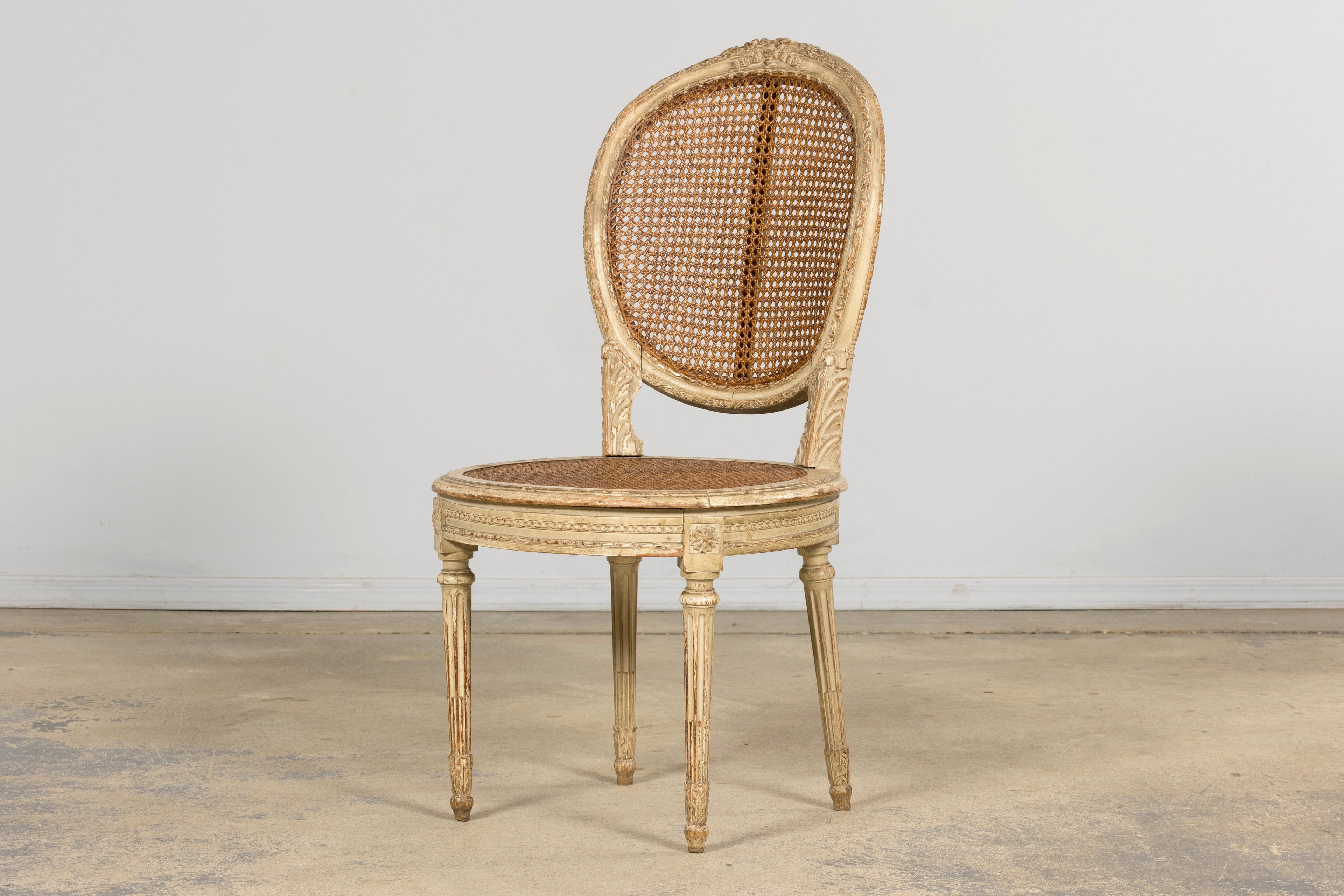 Early 19th Century French Louis XVI Painted Cane Dining Chairs - Set of 10