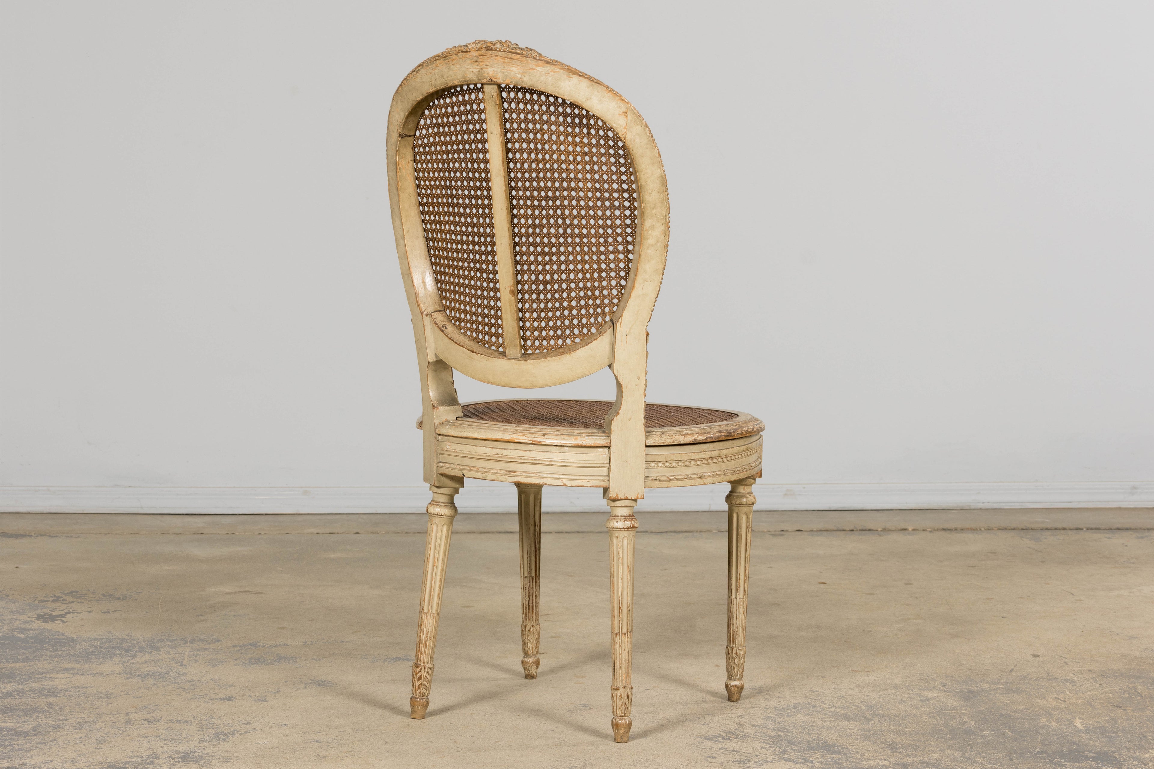 Early 19th Century French Louis XVI Painted Cane Dining Chairs - Set of 10