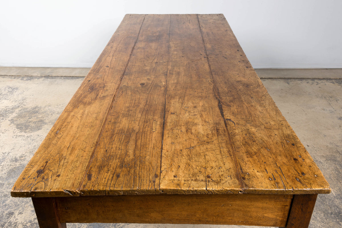 Early 19th Century French Provincial Fruitwood Farmhouse Table with Two Drawers