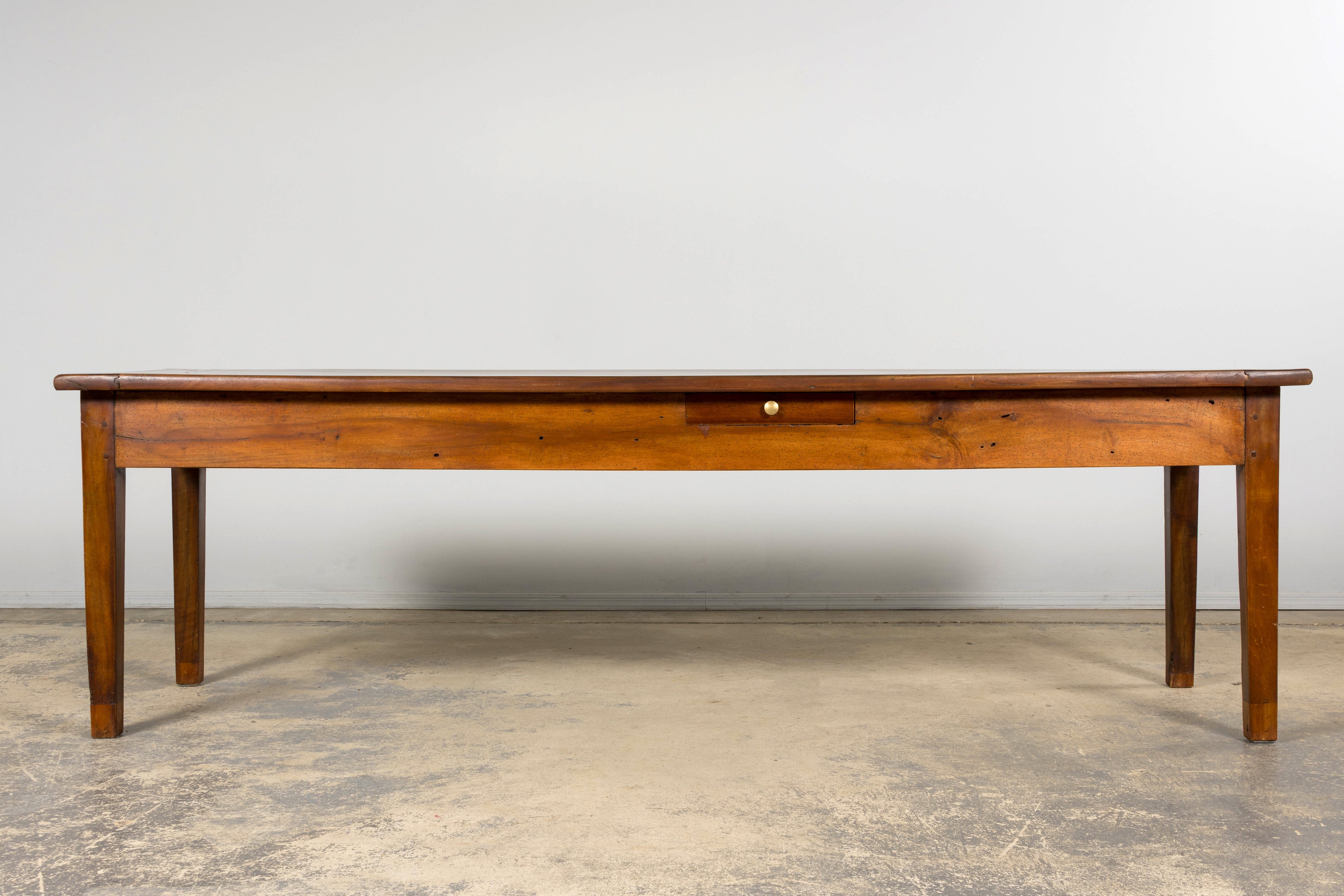Late 19th Century French Provincial Walnut Farmhouse Table with Four Drawers