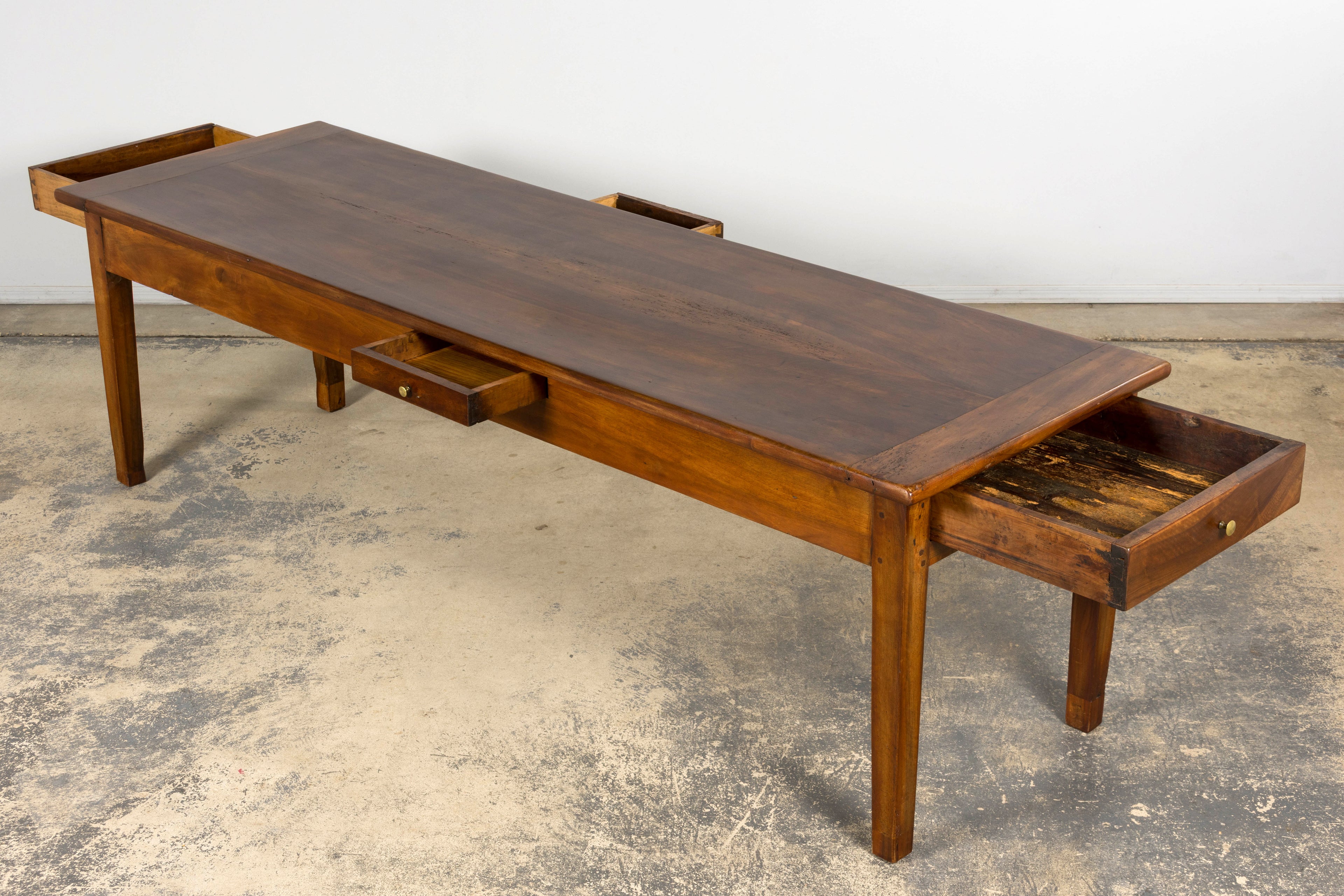 Late 19th Century French Provincial Walnut Farmhouse Table with Four Drawers
