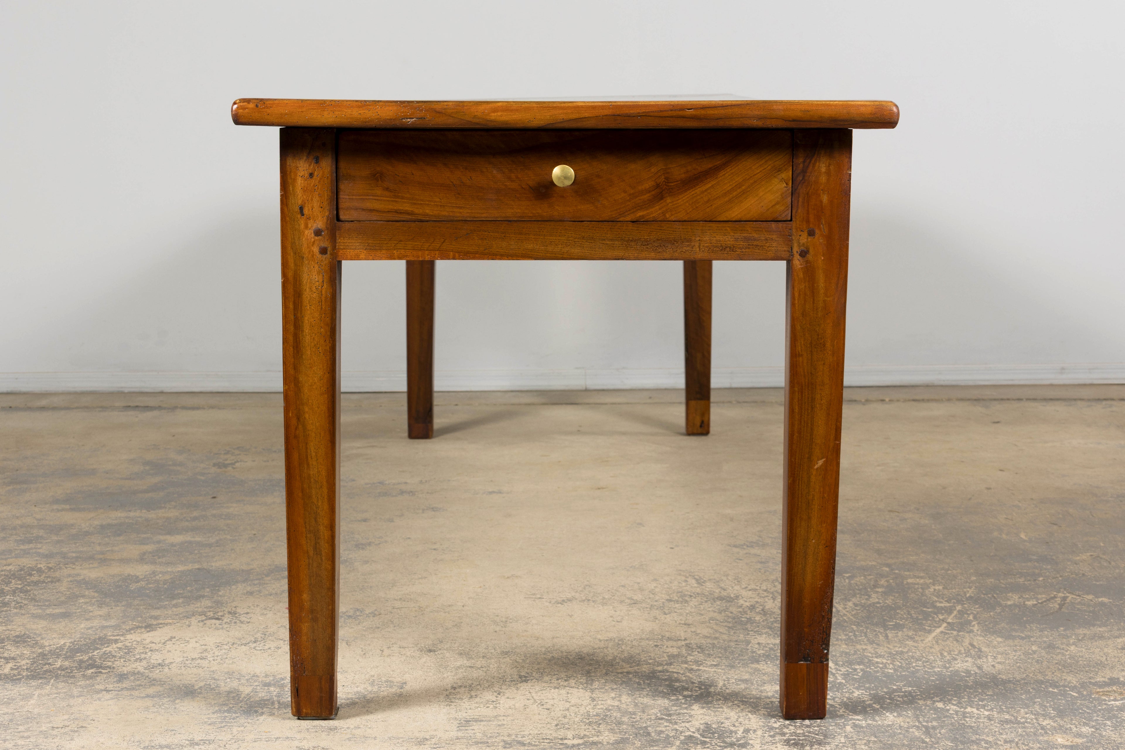Late 19th Century French Provincial Walnut Farmhouse Table with Four Drawers