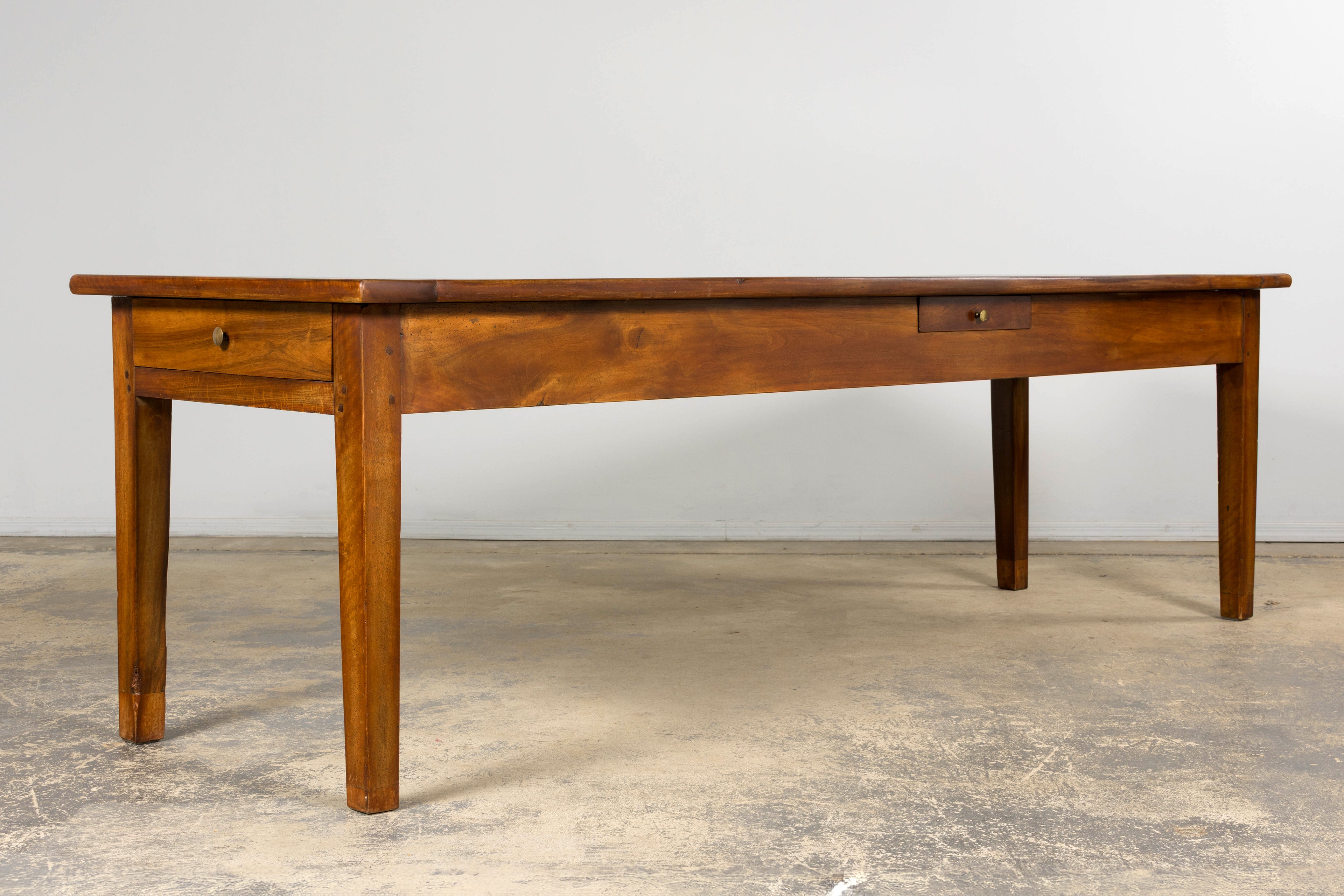 Late 19th Century French Provincial Walnut Farmhouse Table with Four Drawers