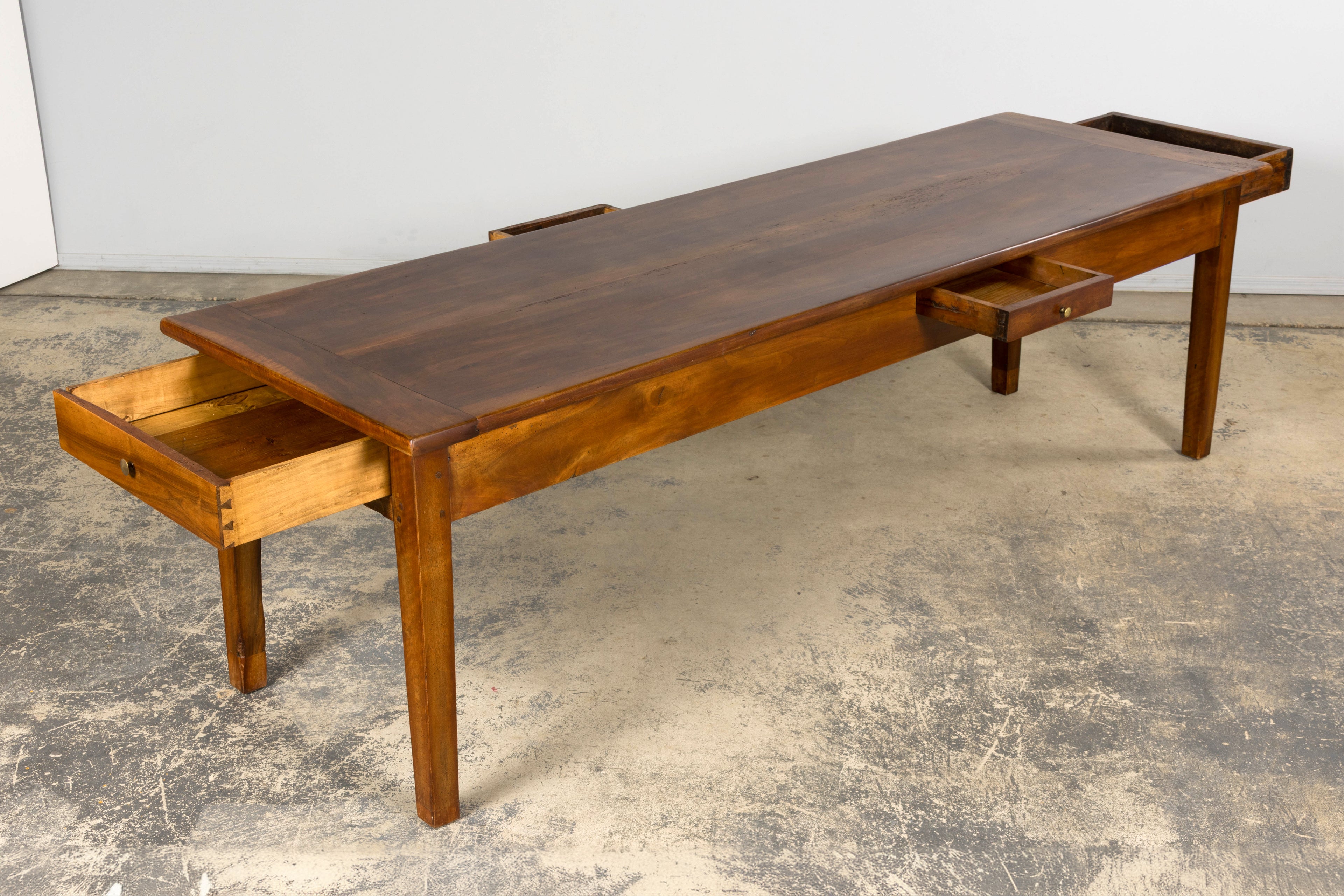 Late 19th Century French Provincial Walnut Farmhouse Table with Four Drawers