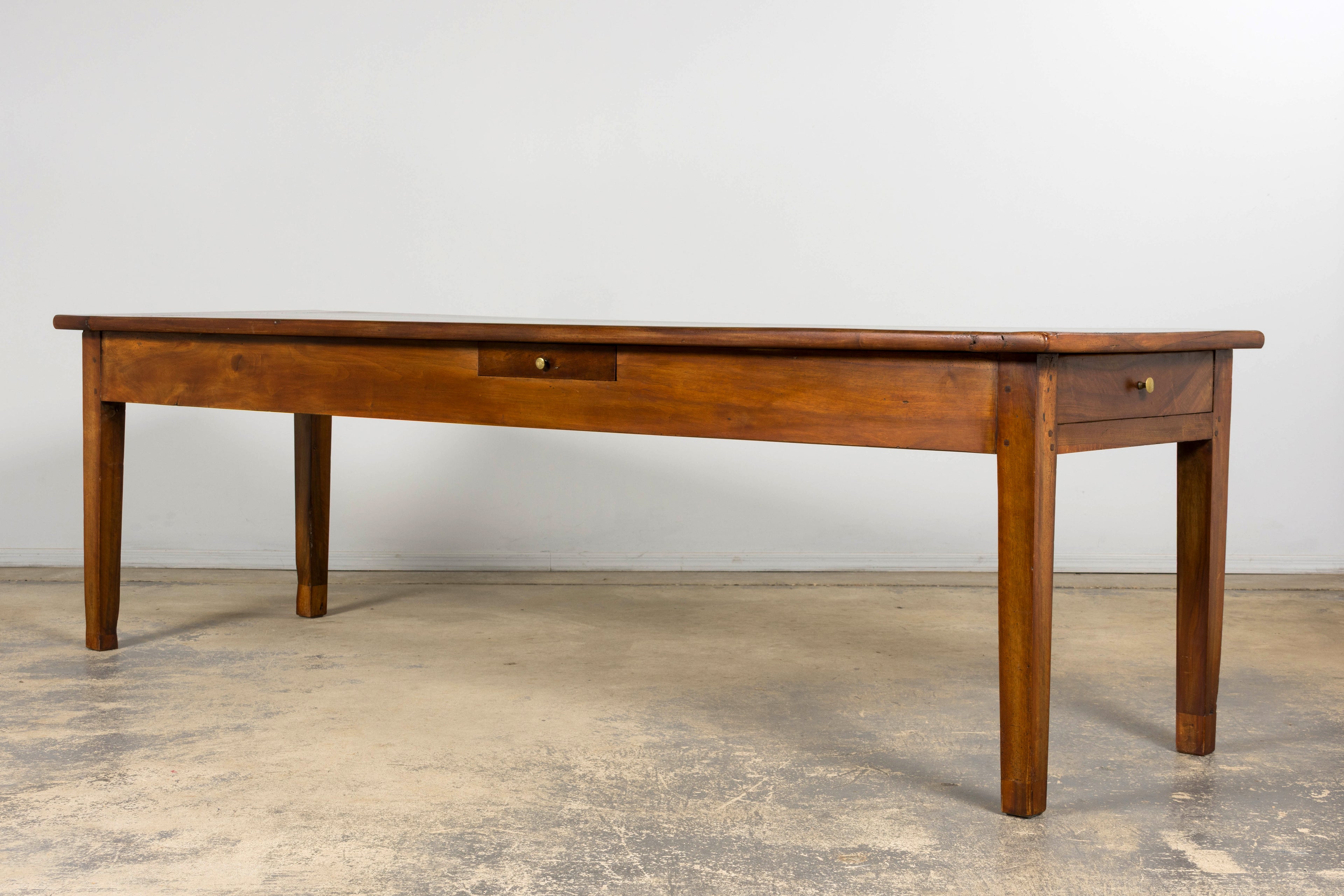 Late 19th Century French Provincial Walnut Farmhouse Table with Four Drawers