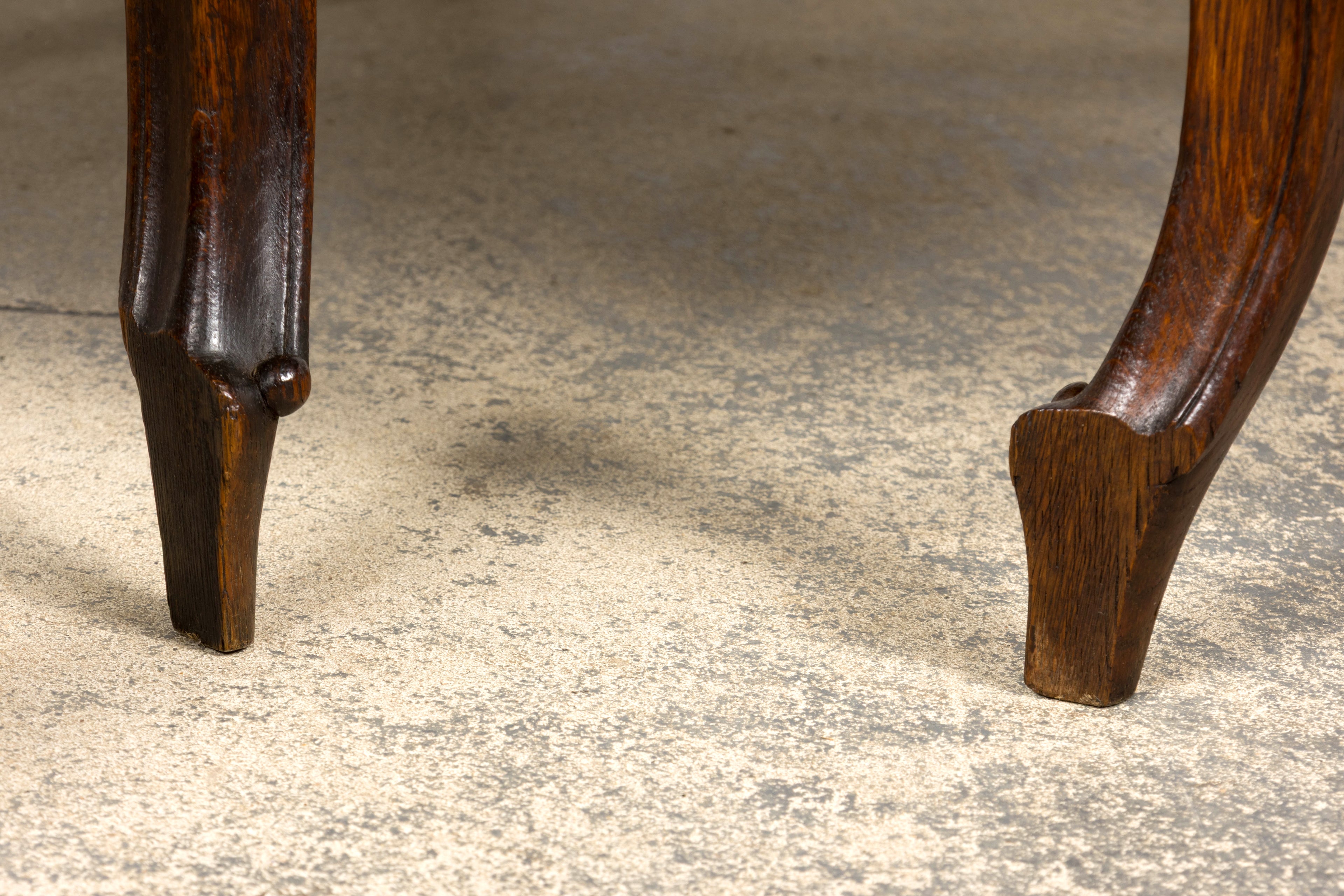Set of 12 Late 19th Century French Renaissance Revival Carved Oak Dining Chairs with Embossed Leather