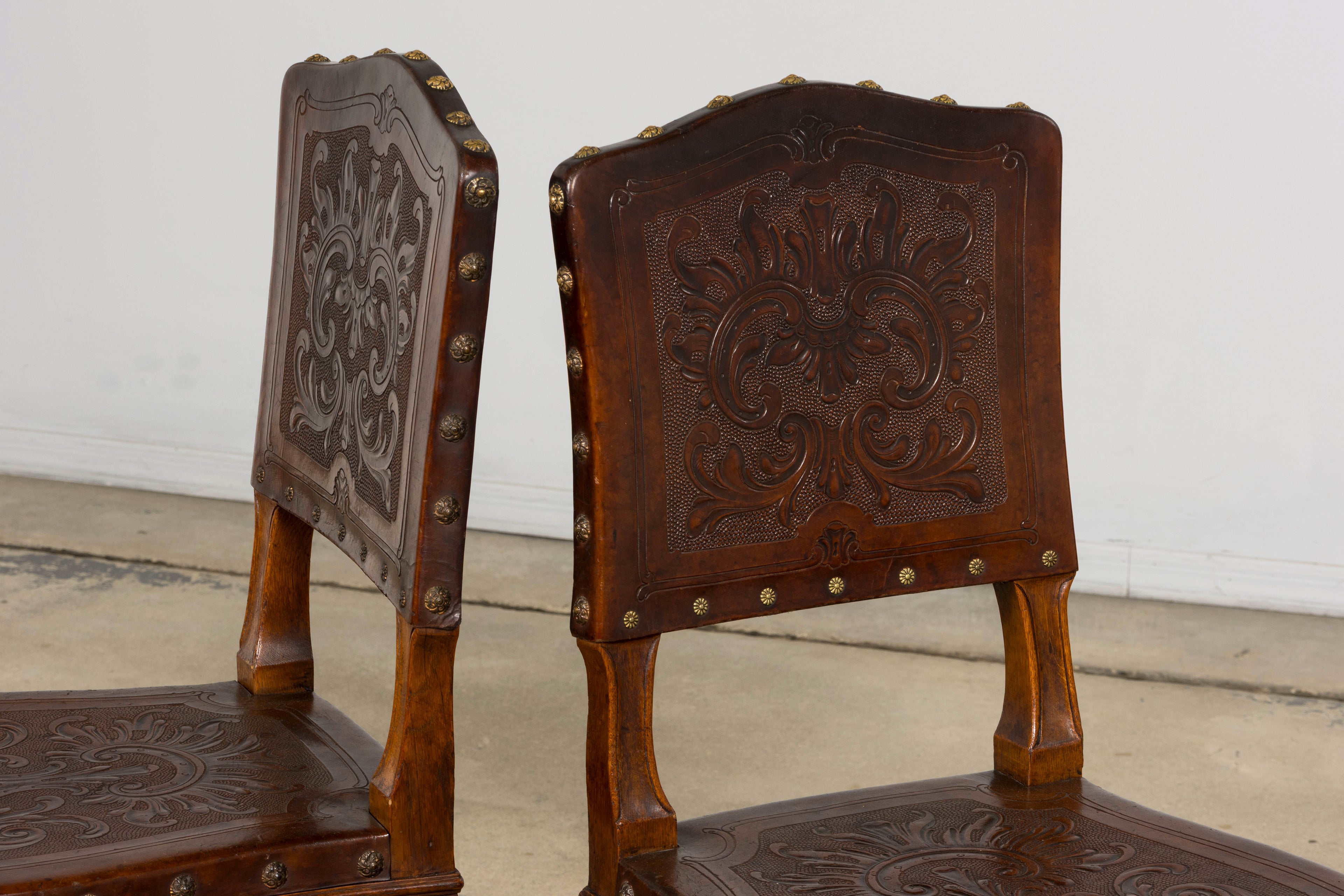 Set of 12 Late 19th Century French Renaissance Revival Carved Oak Dining Chairs with Embossed Leather