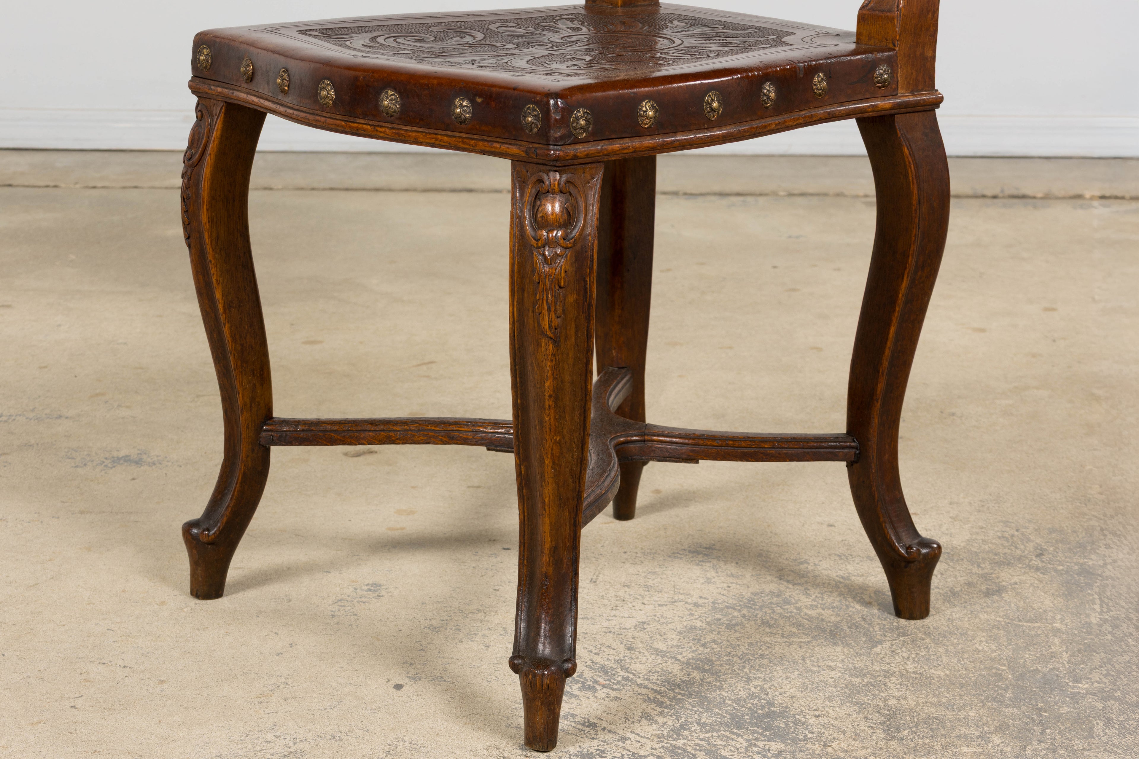 Set of 12 Late 19th Century French Renaissance Revival Carved Oak Dining Chairs with Embossed Leather