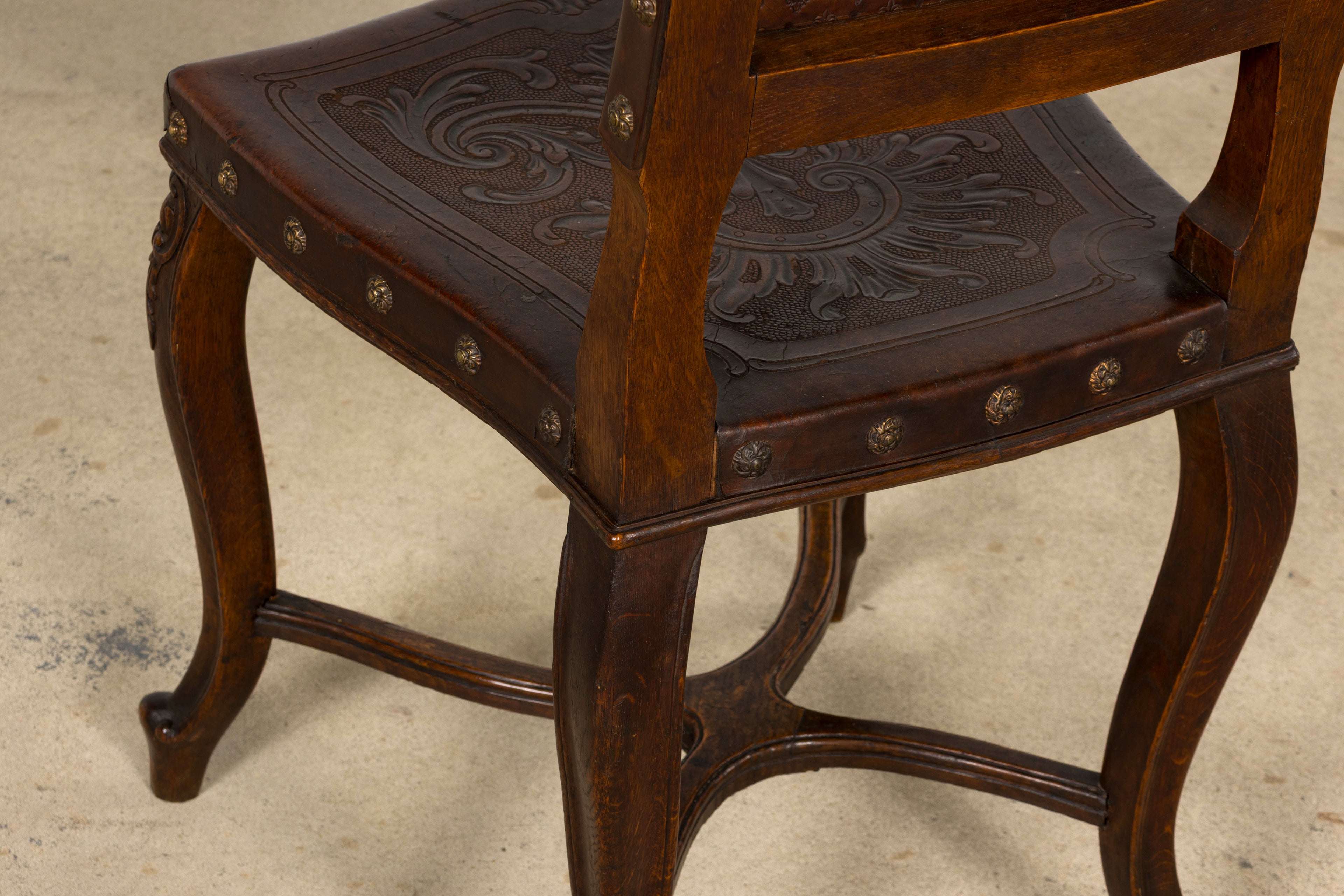 Set of 12 Late 19th Century French Renaissance Revival Carved Oak Dining Chairs with Embossed Leather