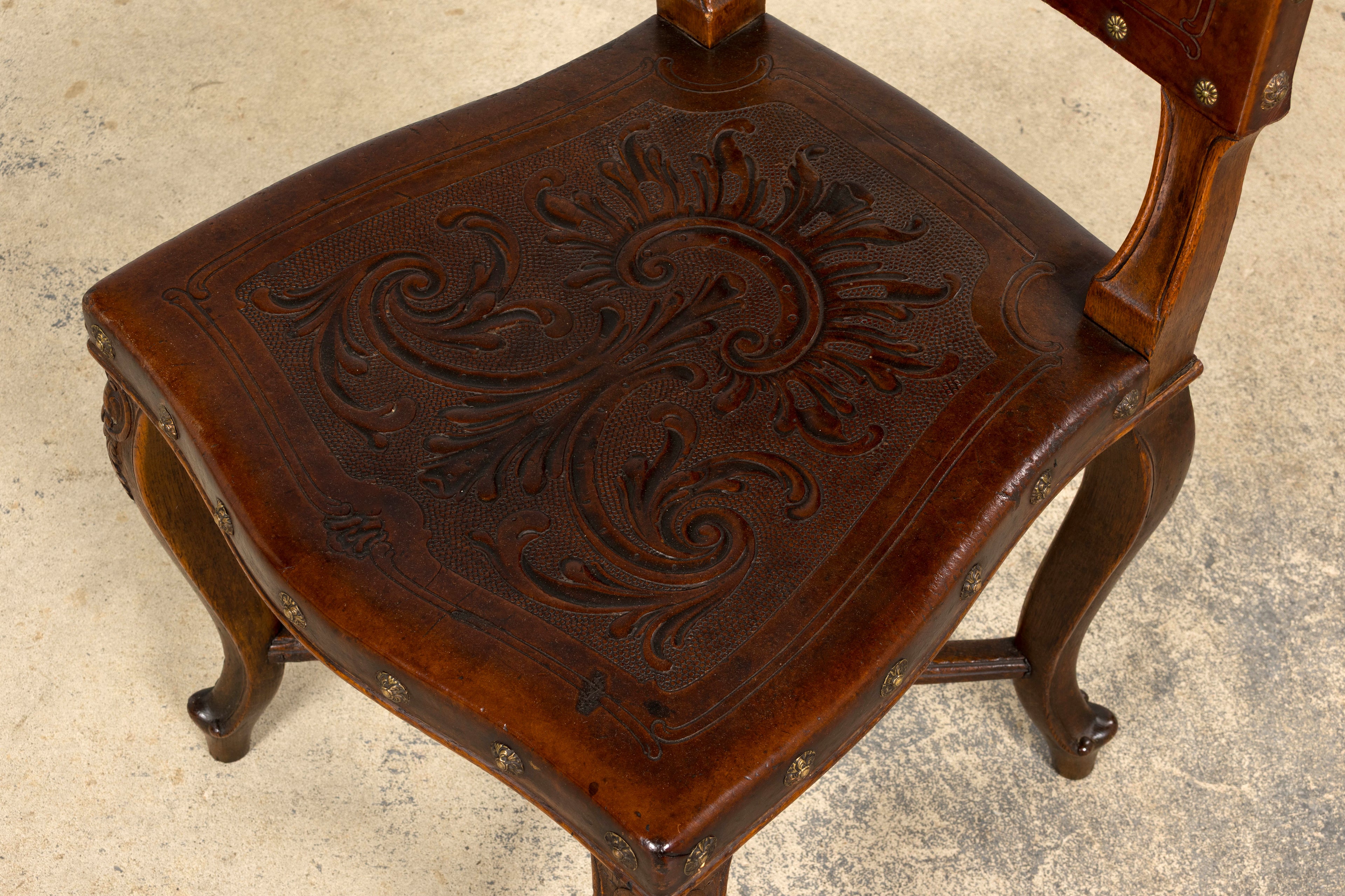 Set of 12 Late 19th Century French Renaissance Revival Carved Oak Dining Chairs with Embossed Leather