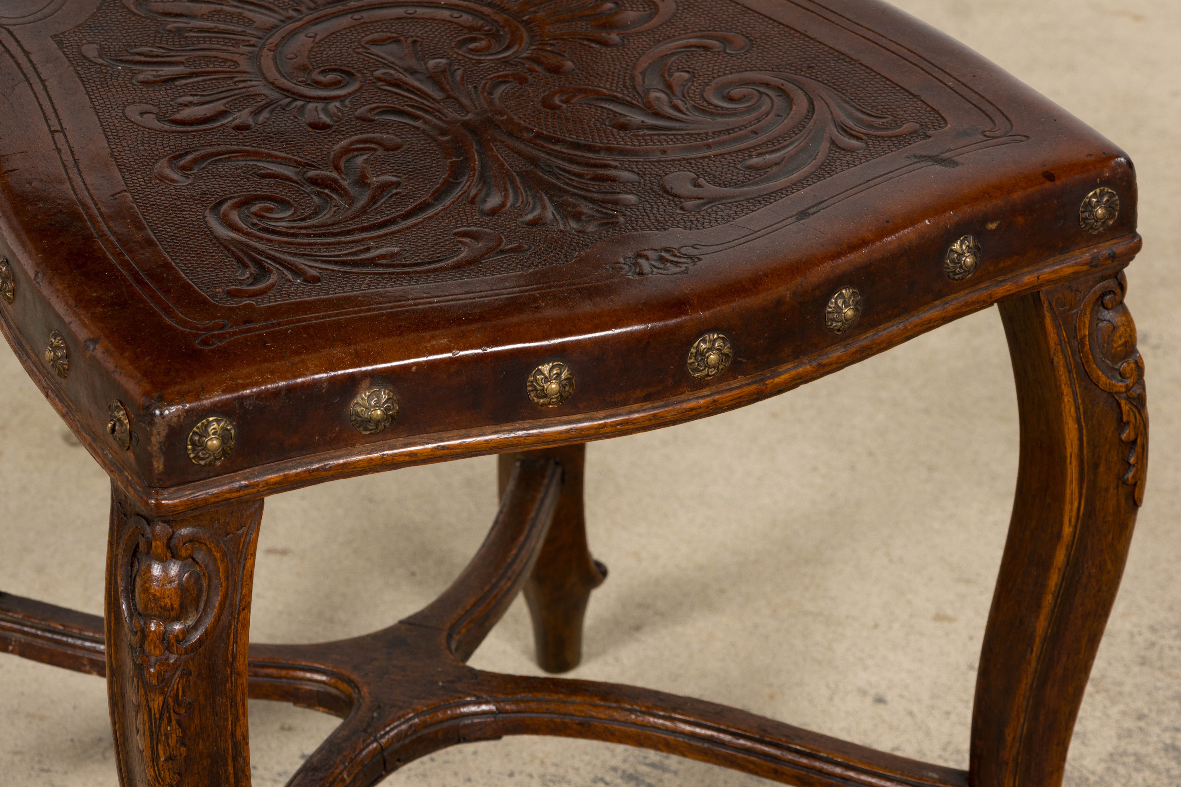 Set of 12 Late 19th Century French Renaissance Revival Carved Oak Dining Chairs with Embossed Leather