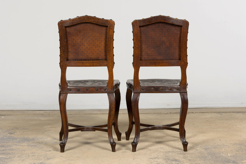 Set of 12 Late 19th Century French Renaissance Revival Carved Oak Dining Chairs with Embossed Leather