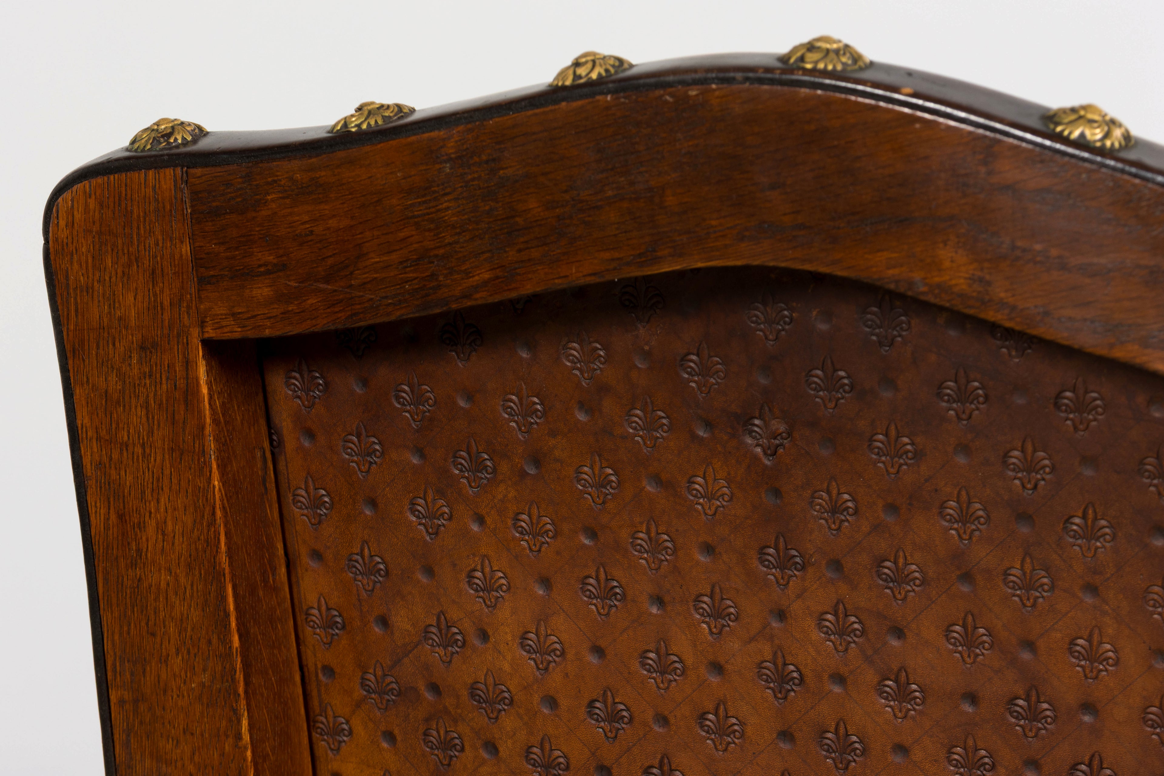 Set of 12 Late 19th Century French Renaissance Revival Carved Oak Dining Chairs with Embossed Leather