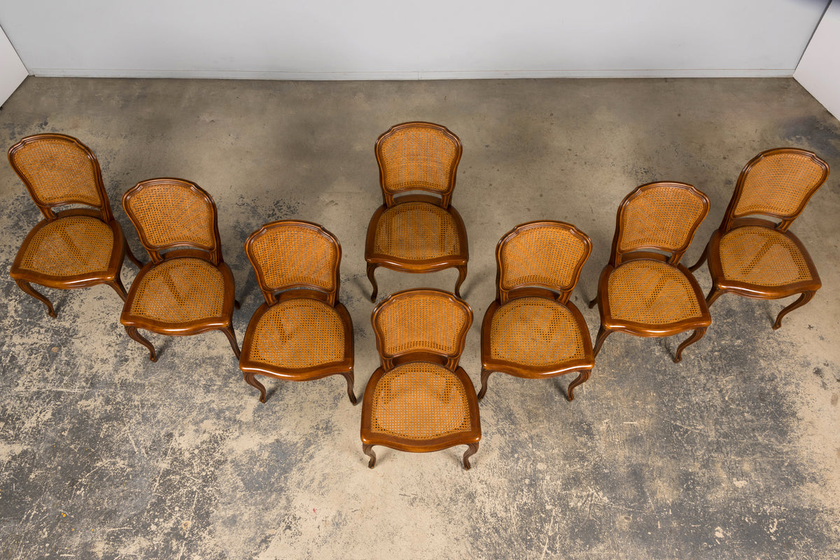 Set of 8 Early 20th Century French Louis XV Style Walnut Cane Dining Chairs