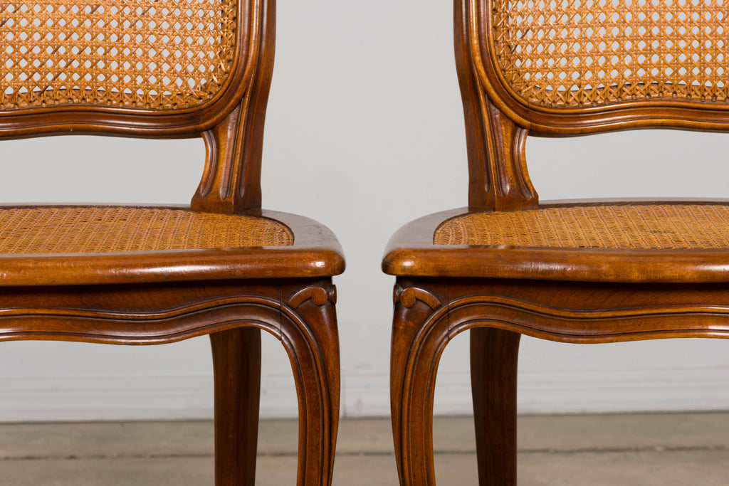 Set of 8 Early 20th Century French Louis XV Style Walnut Cane Dining Chairs