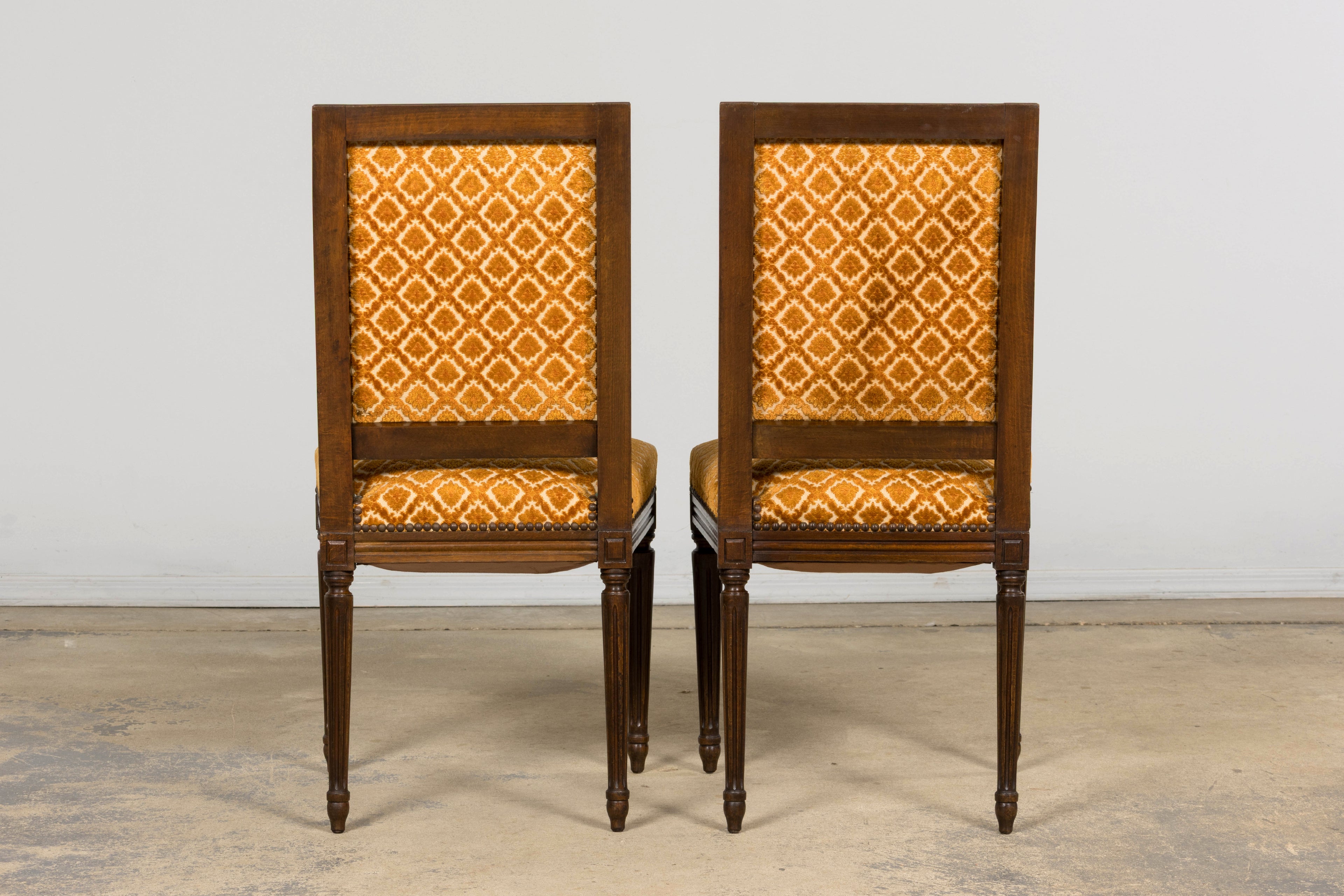 Set of Six Early 20th Century French Louis XVI Walnut Dining Chairs