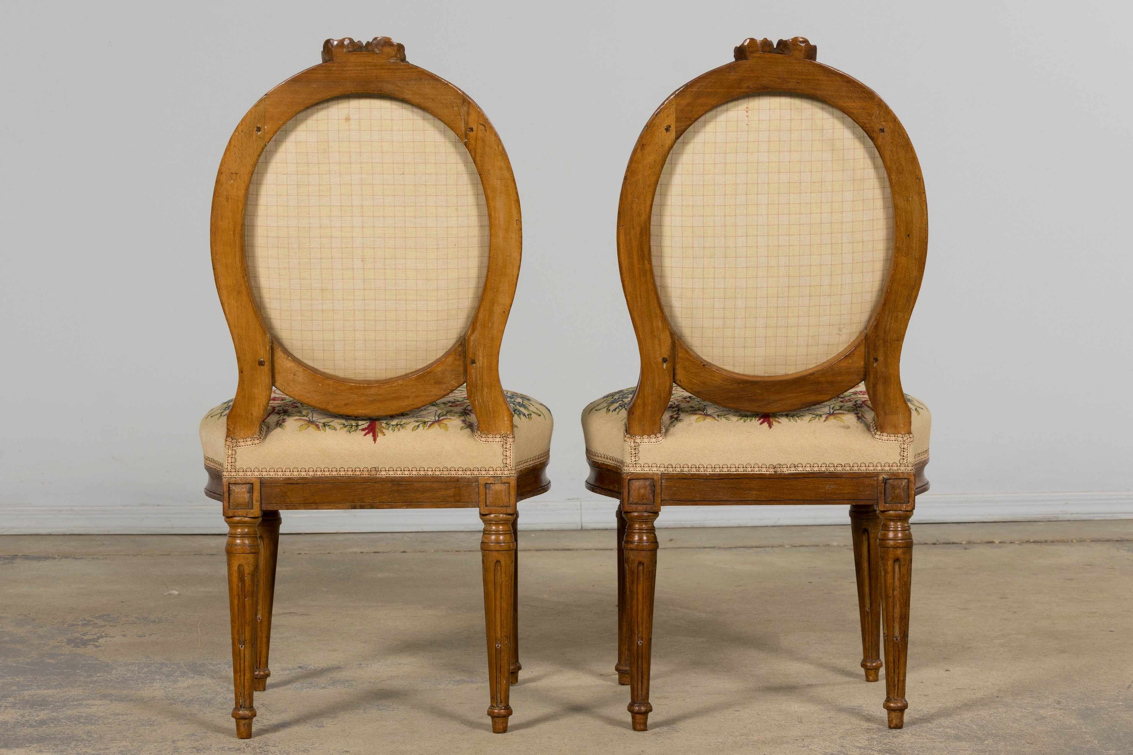 Set of Six Late 19th Century French Louis XVI Style Walnut Chairs with Pair of Fauteuils