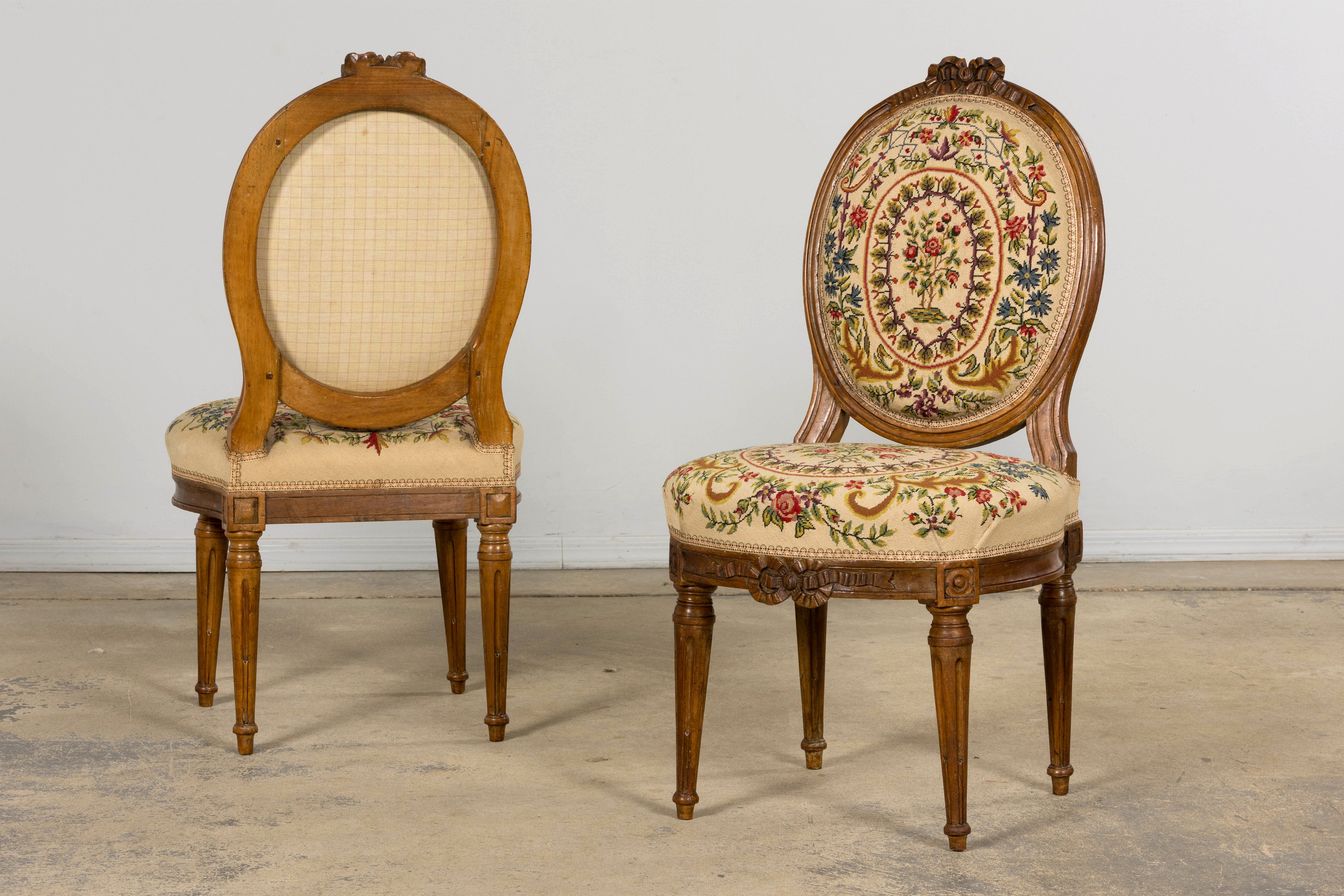 Set of Six Late 19th Century French Louis XVI Style Walnut Chairs with Pair of Fauteuils
