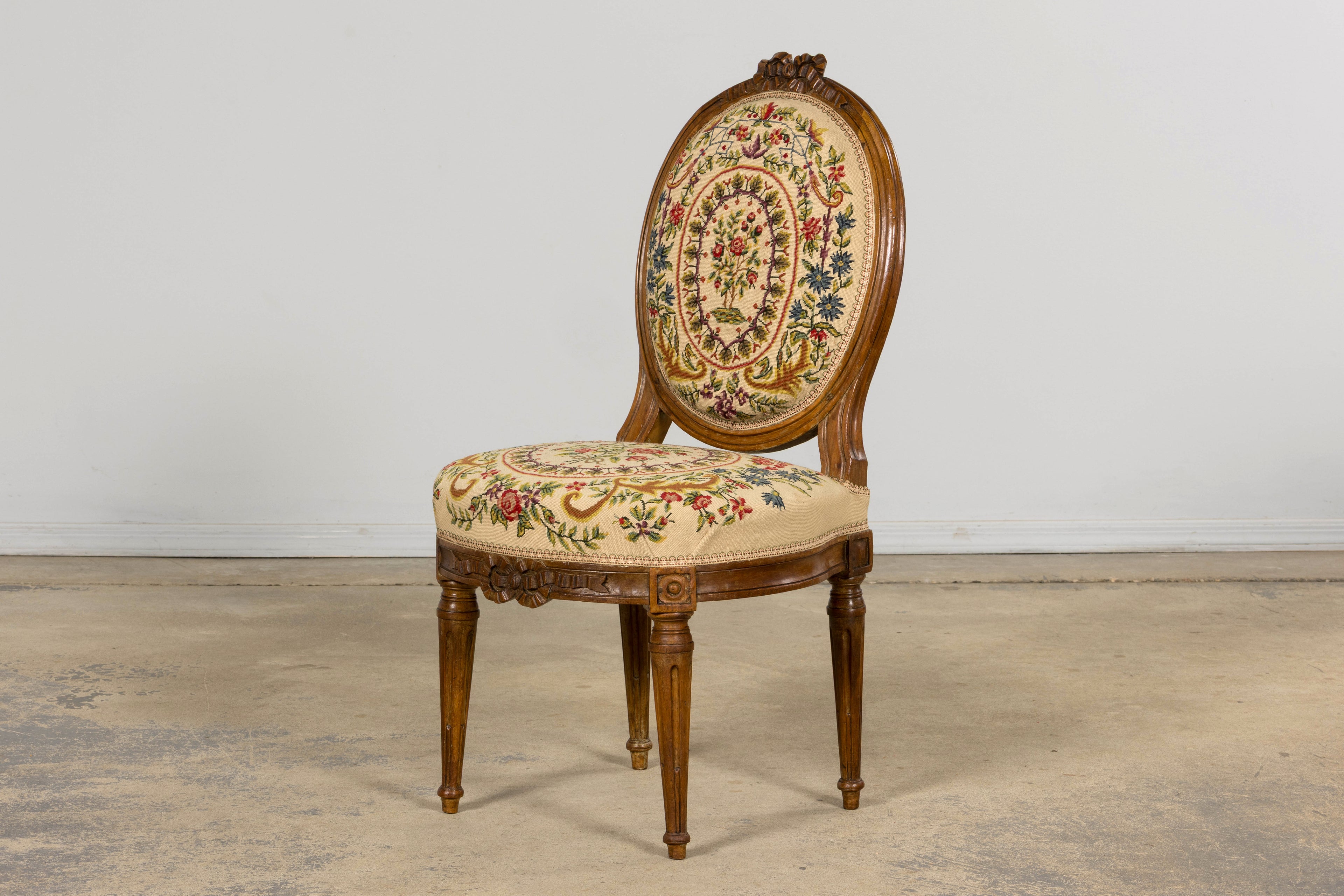 Set of Six Late 19th Century French Louis XVI Style Walnut Chairs with Pair of Fauteuils